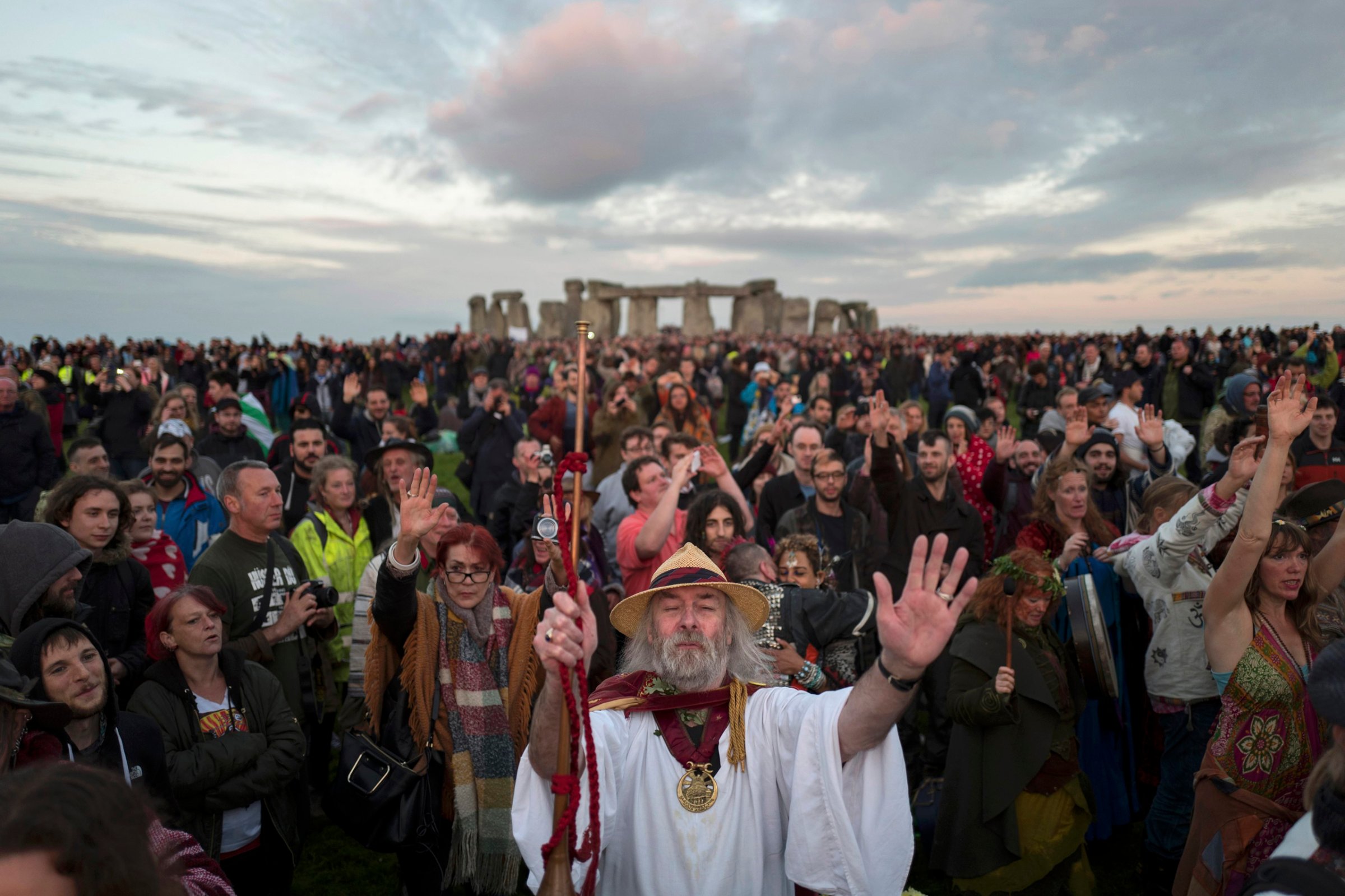 Revellers celebrate the summer solstice at Stonehenge on Salisbury Plain in southern England, on June 21, 2016.
