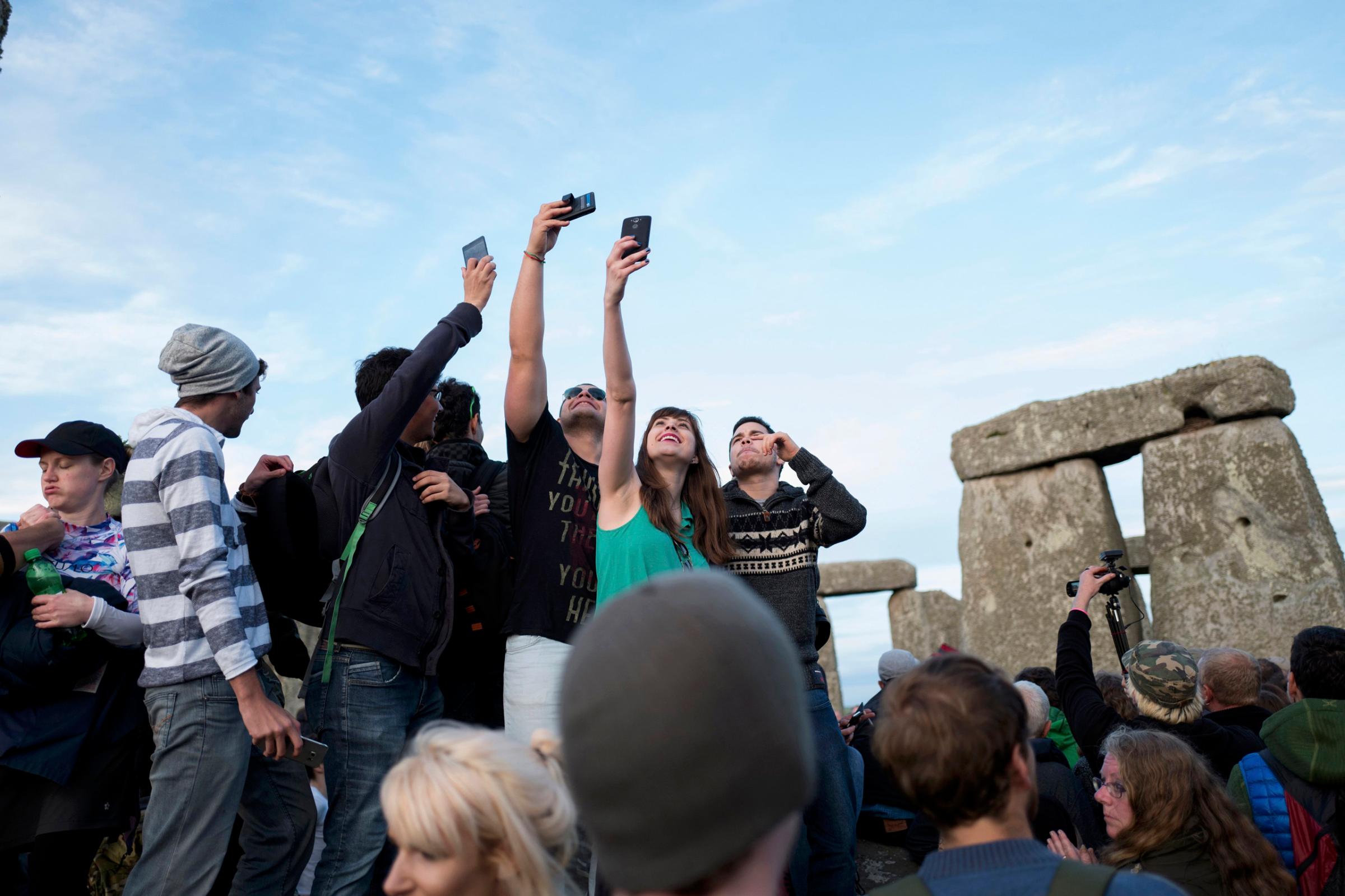 Revellers celebrate the longest day of the year at Stonehenge on Salisbury Plain in southern England, June 20, 2016.