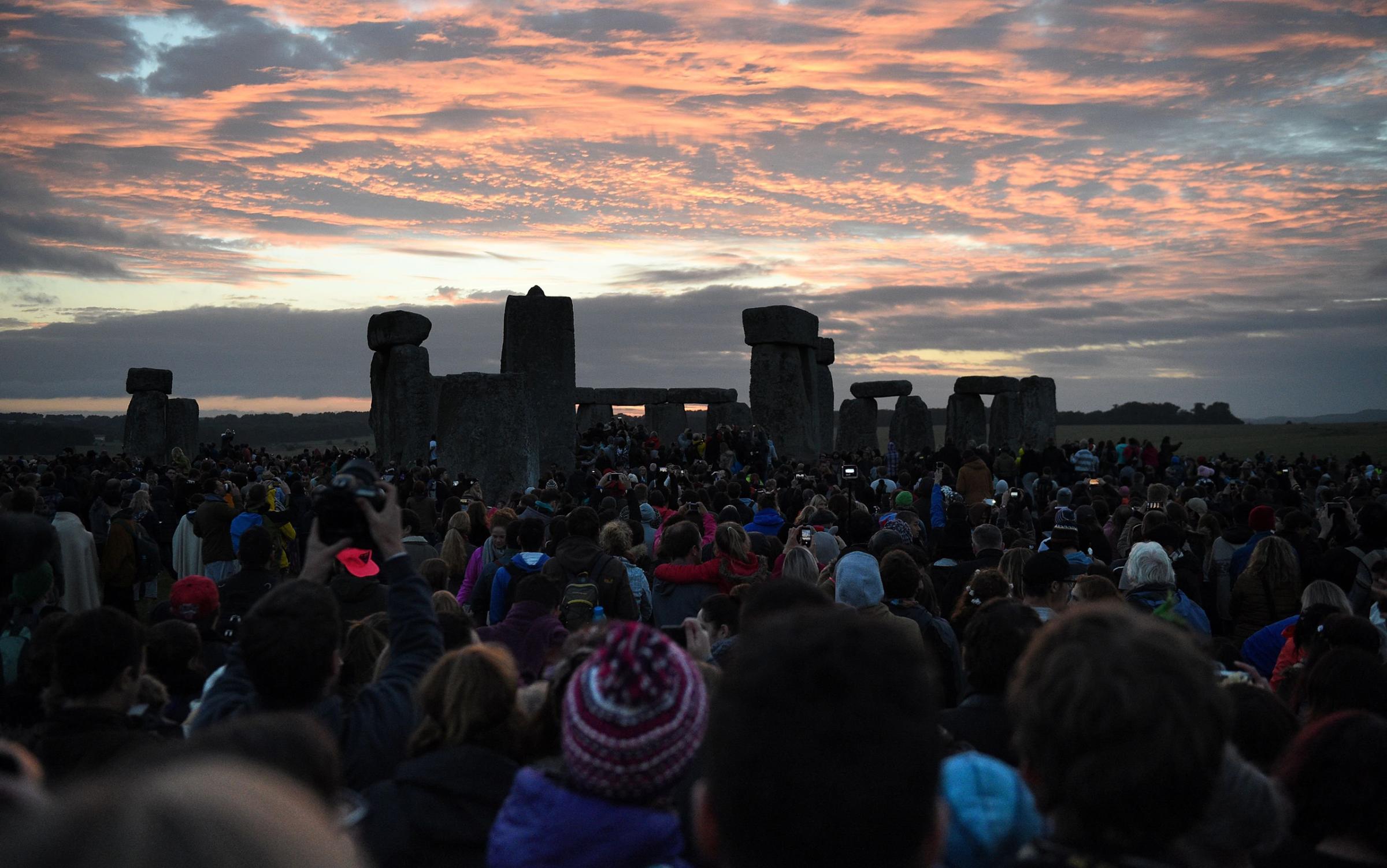 People gather at Stonehenge in Wiltshire to see in the new dawn during this year's Summer Solstice, June 21, 2016.
