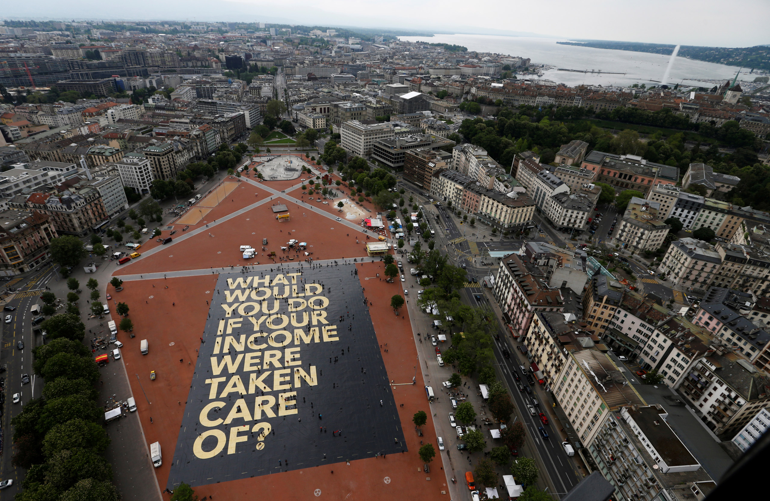 A 8,000 square meter poster is pictured on the Plainpalais square in Geneva, Switzerland May 14, 2016. The committee for the initiative for an "Unconditional Basic Income" has crowdfunded the "world's biggest poster", posing the question "What would you do if your income were taken care of?" (Denis Balibouse—Reuters)