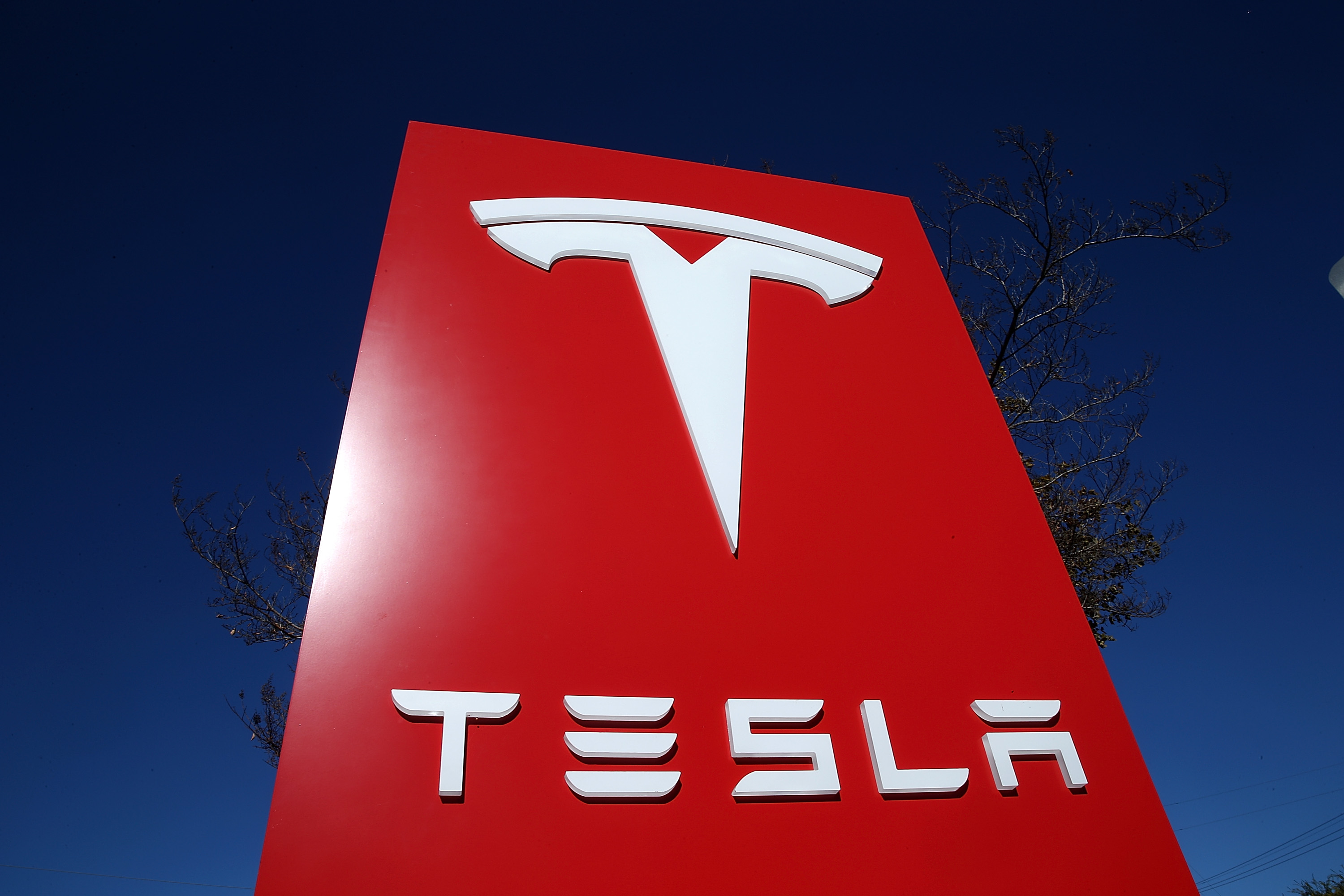 A sign is posted at a Tesla showroom on Nov. 5, 2013 in Palo Alto, California. (Justin Sullivan—Getty Images)
