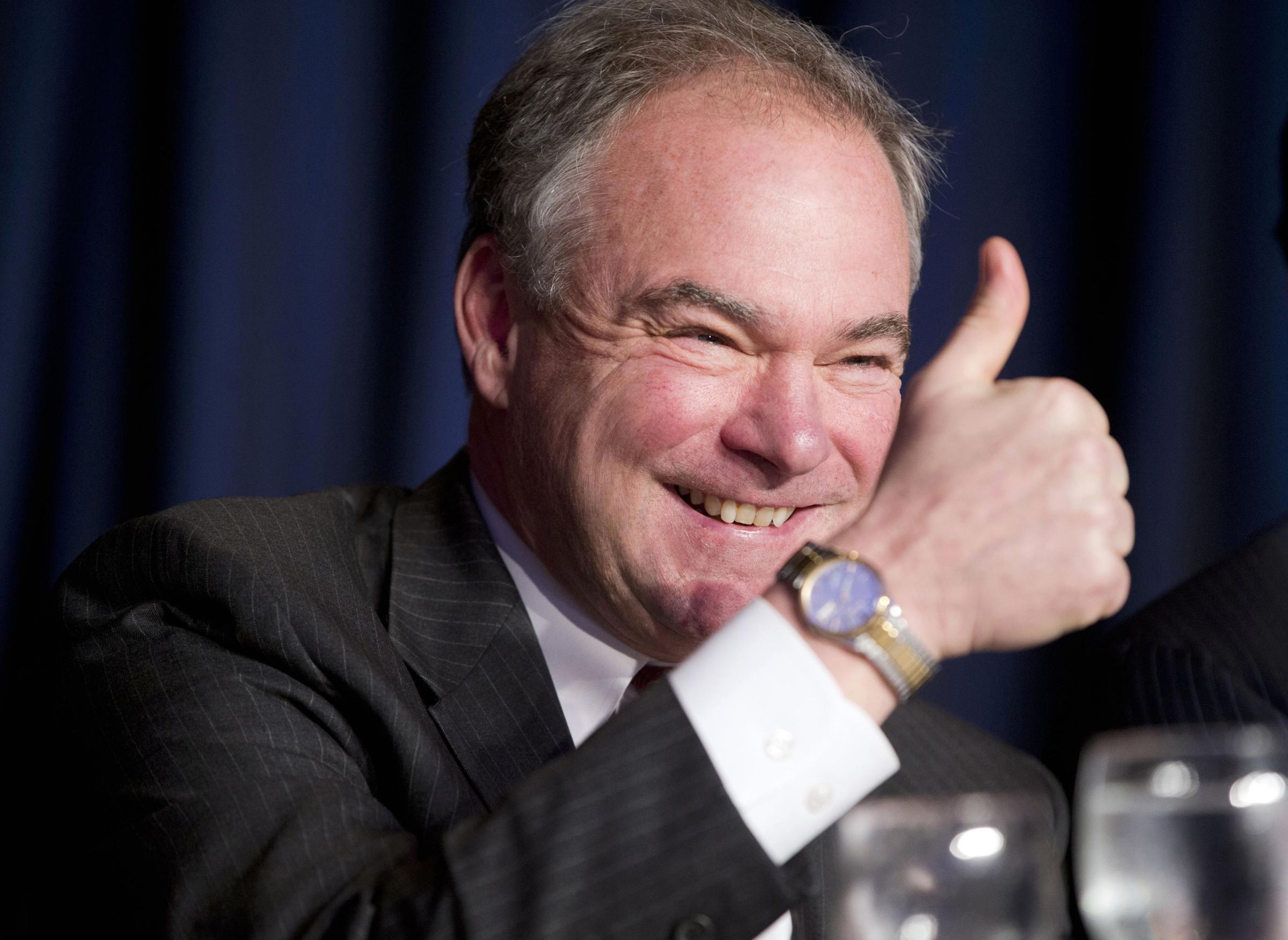Sen. Tim Kaine gives a 'thumbs-up' as he takes his seat at the head table for the National Prayer Breakfast in Washington, D.C. on Feb. 4, 2016.