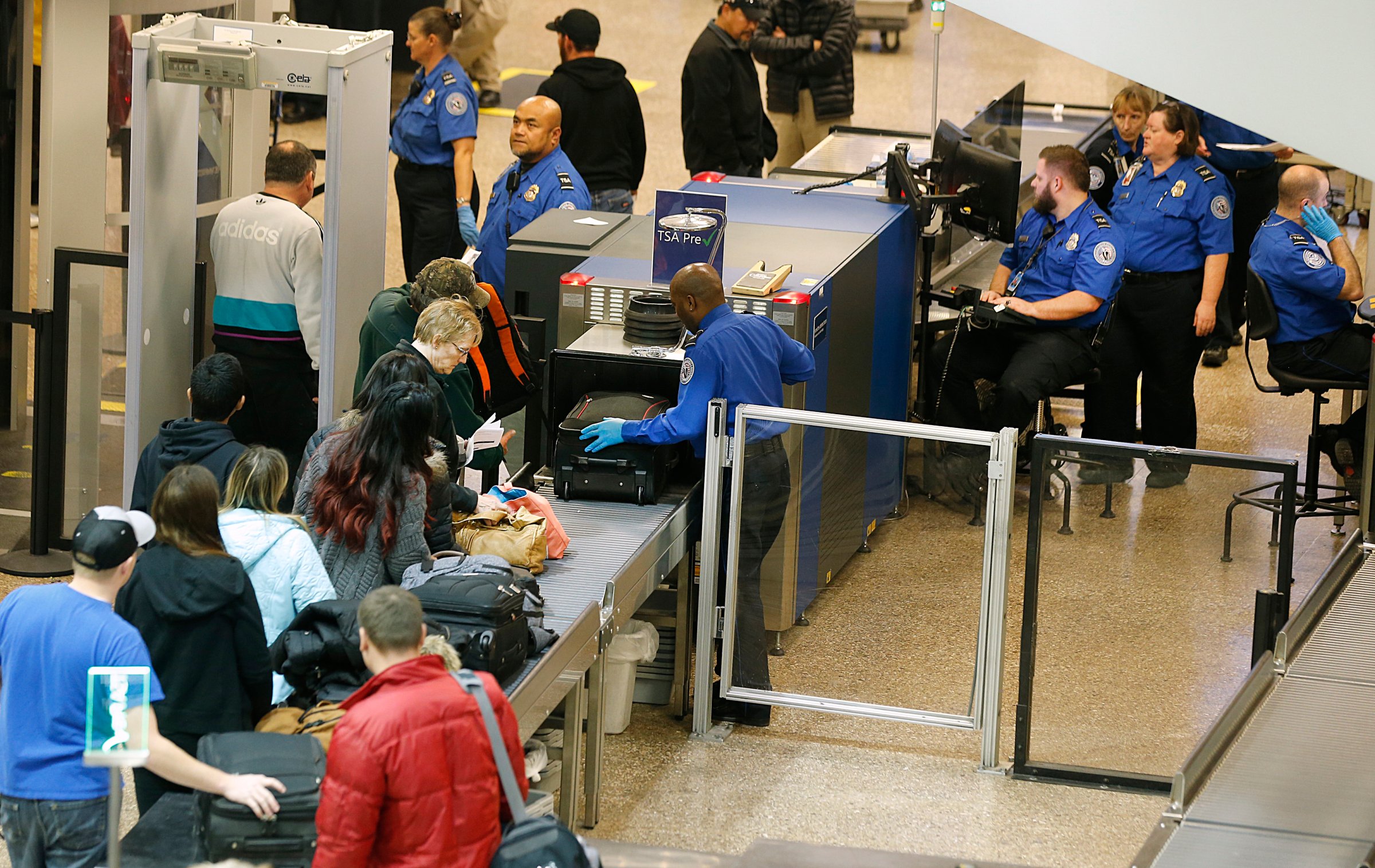 Passengers make their way through a Transportation Security Administration checkpoint at Salt Lake City International Airport in Salt Lake City, Utah on Dec. 23, 2014.