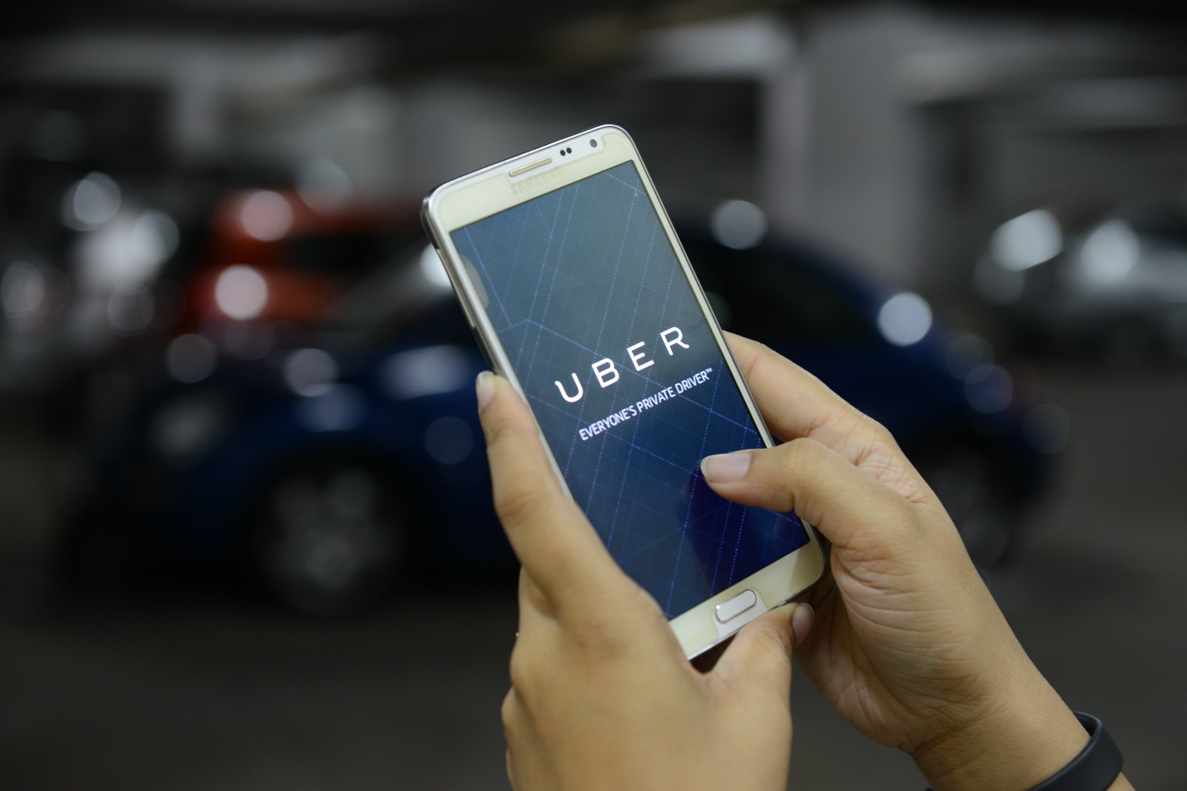 UBER cabs booking using mobile app on October 01 2015 in Bengaluru, India.