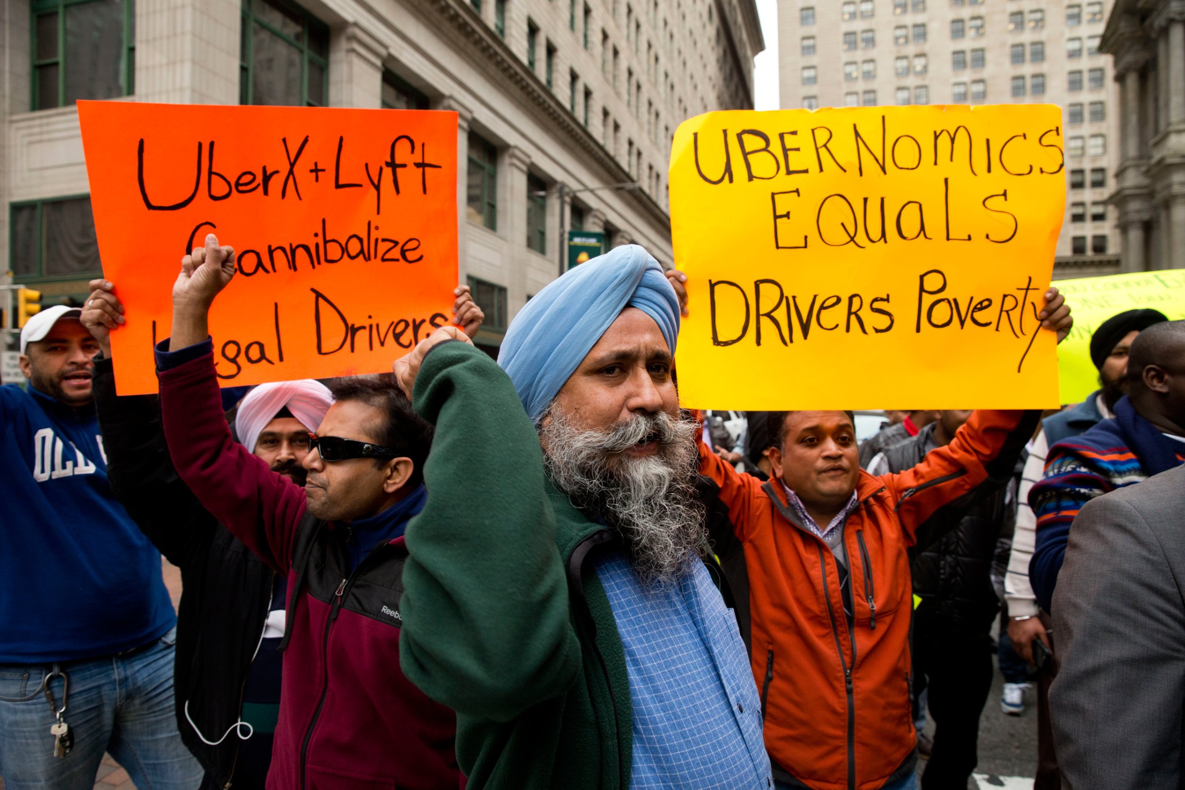 Taxi and Uber's black car service drivers protest the ride-hailing services Uber X and Lyft Wednesday, Dec. 16, 2015, in Philadelphia. The drivers are protesting that Uber and Lyft are operating without legal approval in the city. Uber says it understands drivers’ frustration but blames regulation by the Philadelphia Parking Authority and says riders are looking for an alternative. (AP Photo/Matt Rourke)