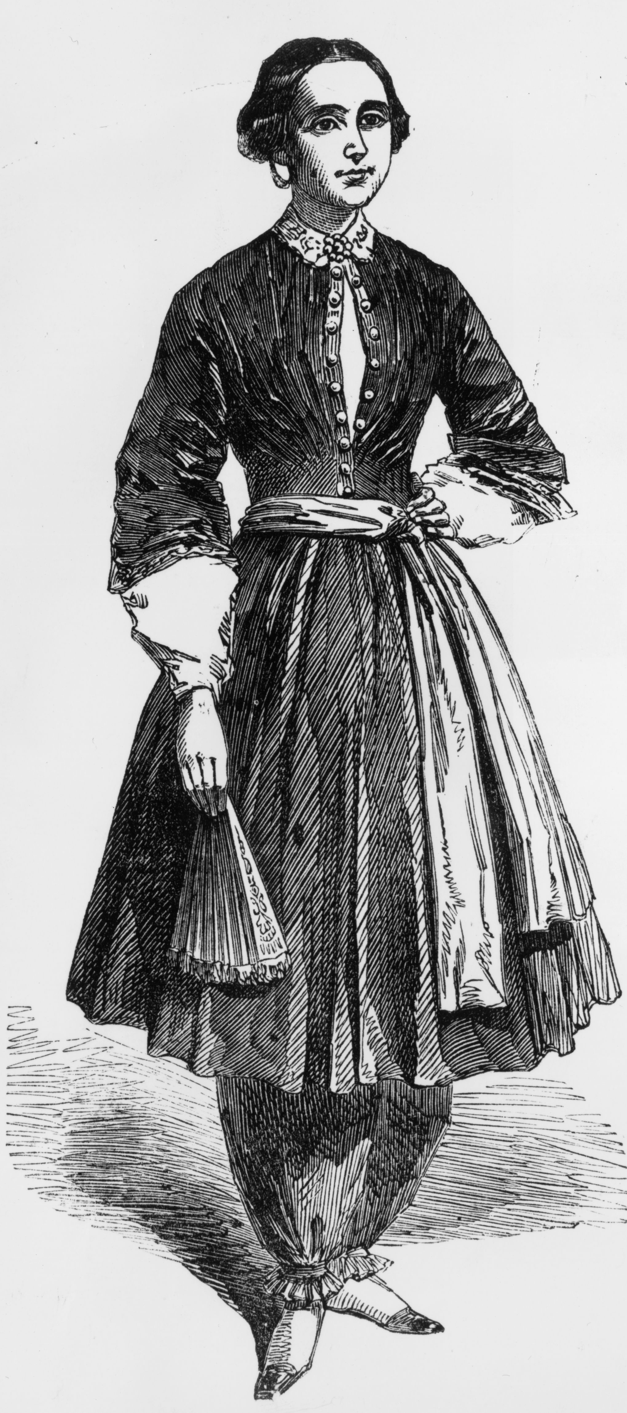 Amelia Bloomer, champion of women's rights and dress reform, wearing the 'trousers' she designed which were called 'bloomers', circa 1855.