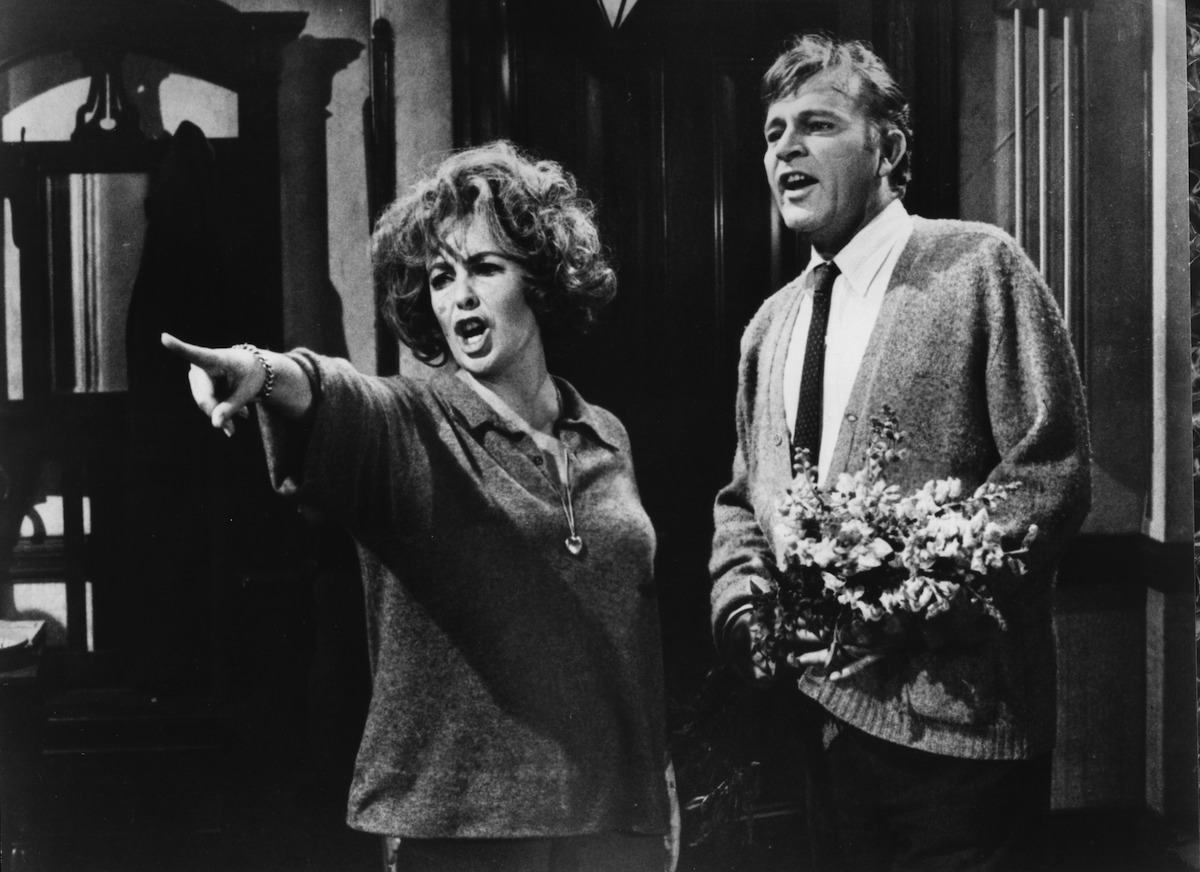 Elizabeth Taylor angrily points as Richard Burton looks on in a scene from the  Warner Bros movie 
