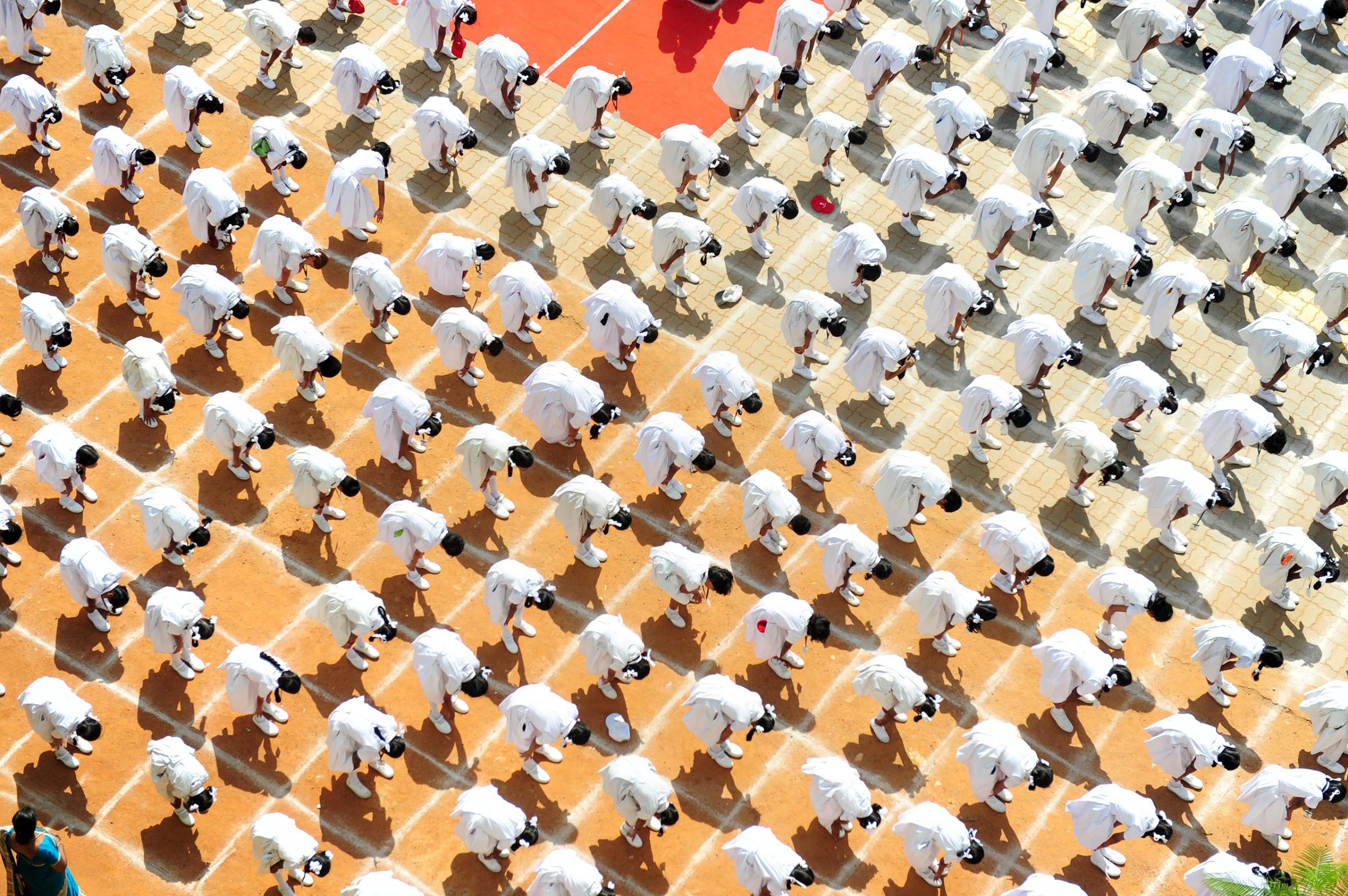 4001 Indian schoolchildren participate in a yoga session on the eve of International Yoga Day at a school in Chennai, India, on June 20, 2016.