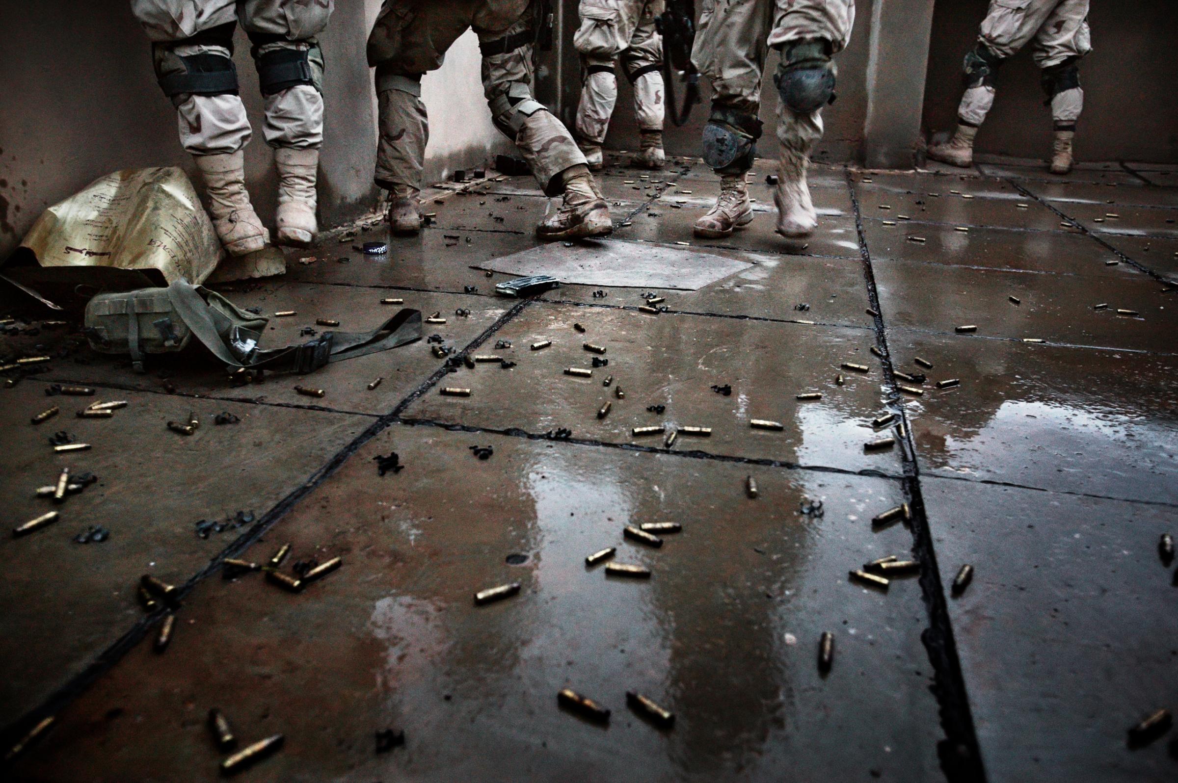 Shell casings line a rooftop where soldiers with the Army Task Force 2-2's Alpha Company, 3rd Platoon fight insurgents during a major offensive to clear the city of extremists, Fallujah, Nov. 9, 2004.