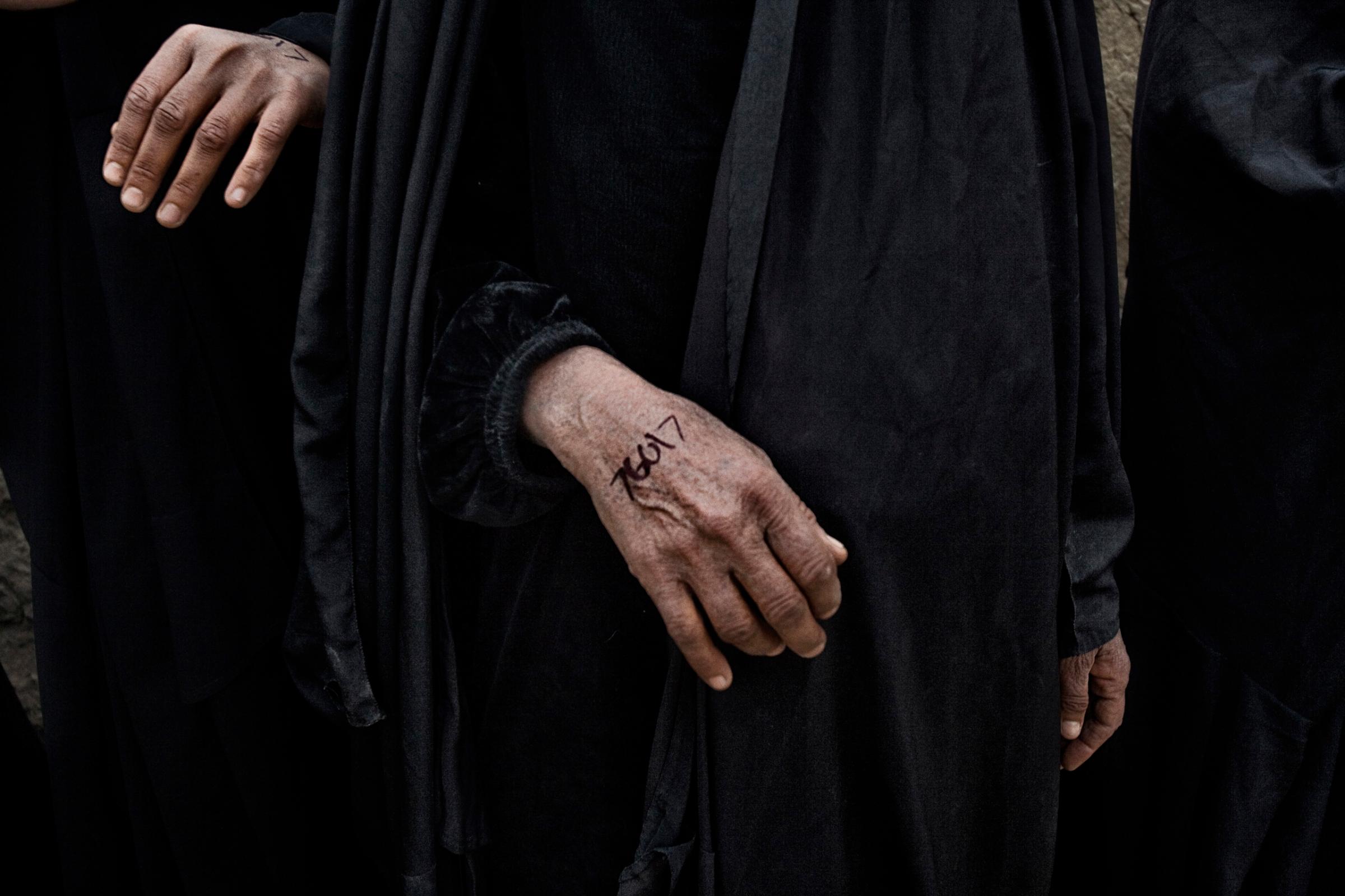 Numbers written on the hand of an Iraqi woman in Qubah, a village in Diyala Province, Iraq, March 24, 2007.