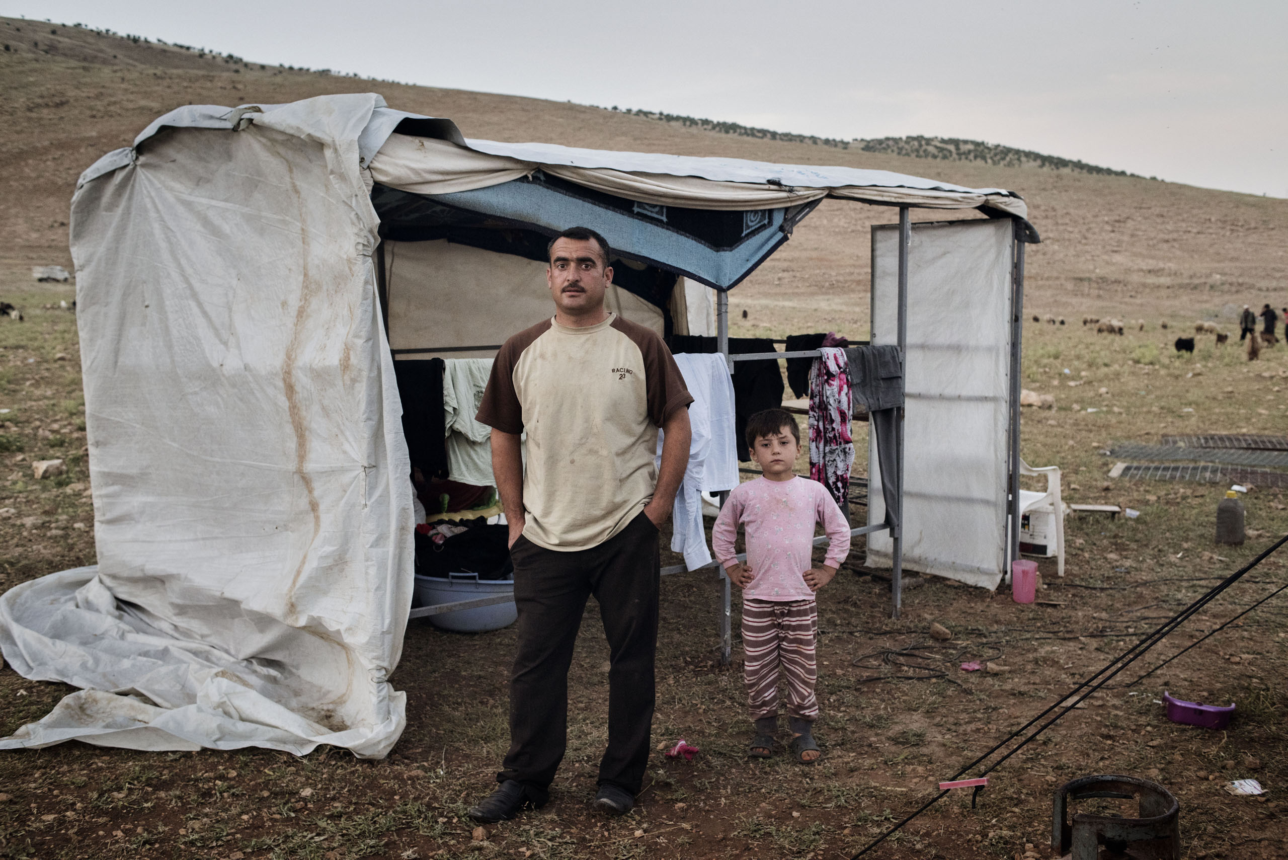 Qubad Miqdad Murad, a police officer in his thirties, stands in a camp for internally displaced people near the Iraqi town of Sinjar, May 13, 2016. Murad returned to Sinjar after Kurdish forces recaptured it from ISIS in Nov. 2015, but he since decided to move to the IDP camp in the mountains above Sinjar, fearing for the safety of his family as ISIS continues to shell the area.