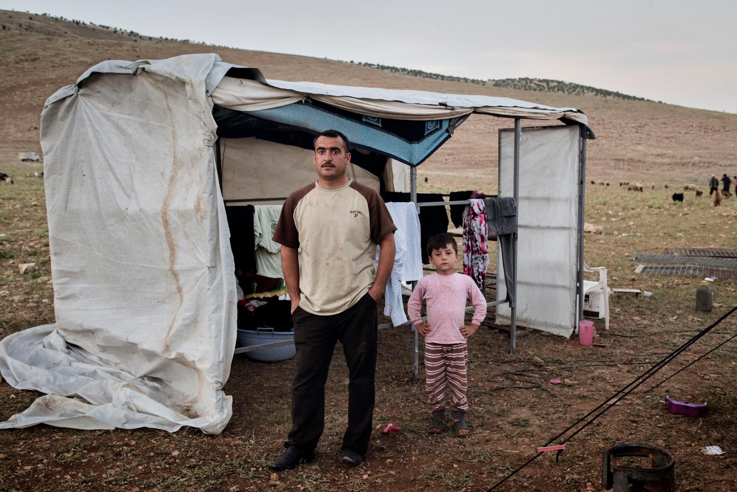 Qubad Miqdad Murad, a police officer in his thirties, stands in a camp for internally displaced people near the Iraqi town of Sinjar, May 13, 2016. Murad returned to Sinjar after Kurdish forces recaptured it from ISIS in November 2015, but he since decided to move to the IDP camp in the mountains above Sinjar, fearing for the safety of his family as ISIS continues to shell the area