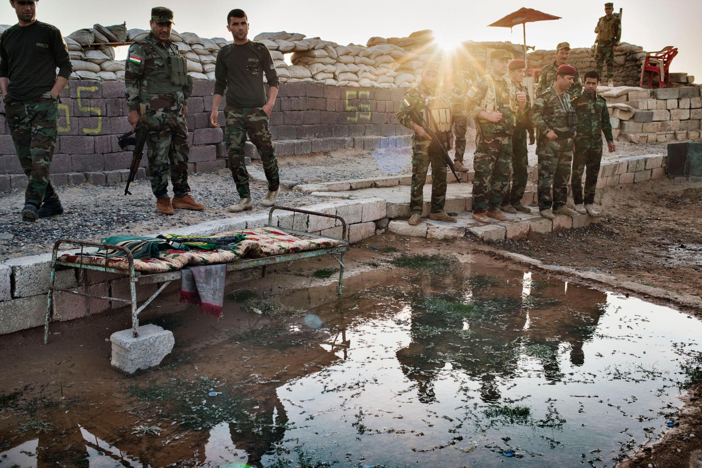 Kurdish Peshmerga at a small outpost near Makhmour, Kurdistan, northern Iraq, May 8, 2016. These fighters, many armed only with Russian AKs, blocked the ISIS advance into Kurdistan in 2014 after tens of thousands in the Iraqi Army that were trained and equipped with U.S. tanks and artillery fled, abandoning equipment and shedding their uniforms. In late 2015, the Peshmerga quietly opened their base in Makhmour.