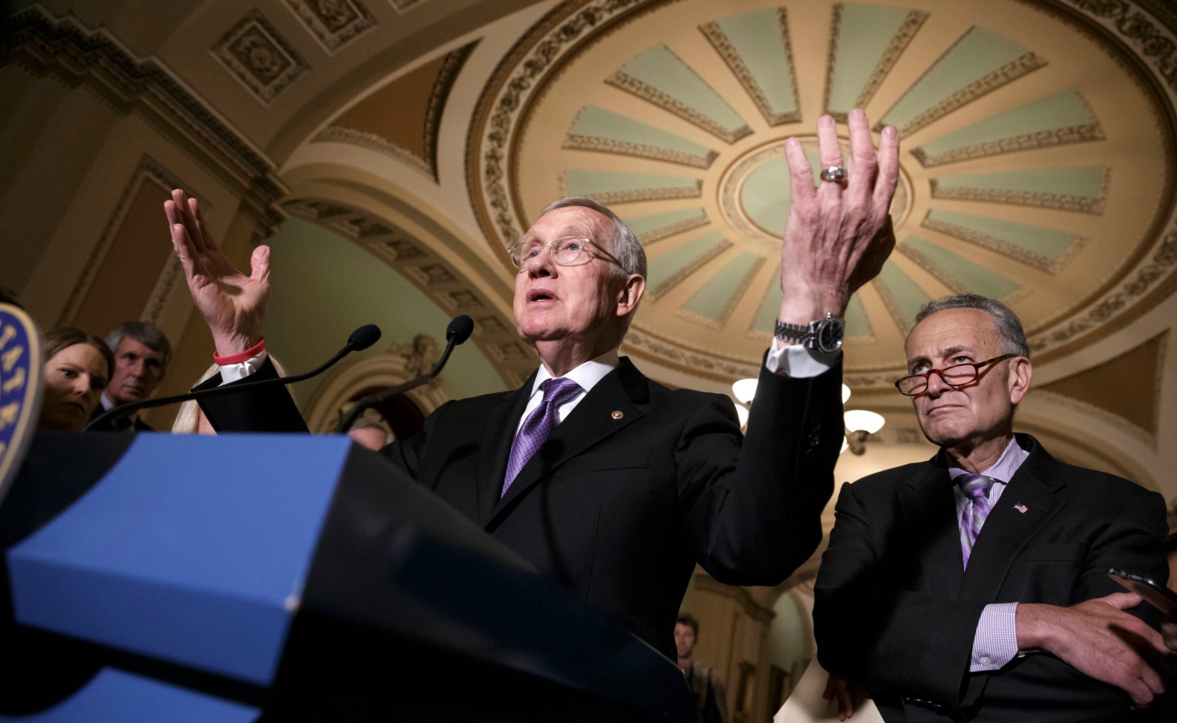 Senate Minority Leader Harry Reid of Nev., accompanied by Sen. Charles Schumer, right, faces reporters on Capitol Hill in Washington, June 28, 2016.