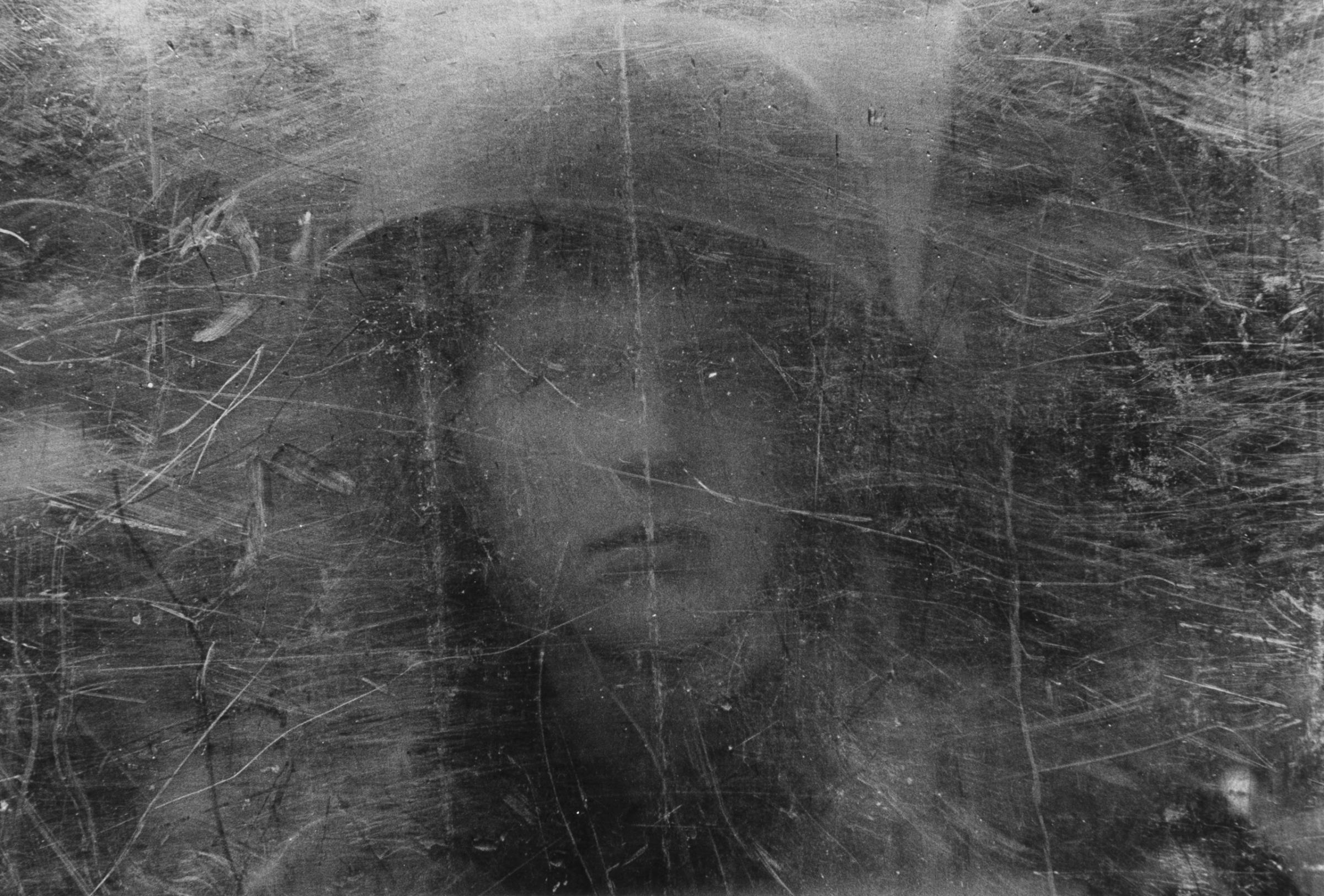 Soldier seen through shield, Northern Ireland, 1973