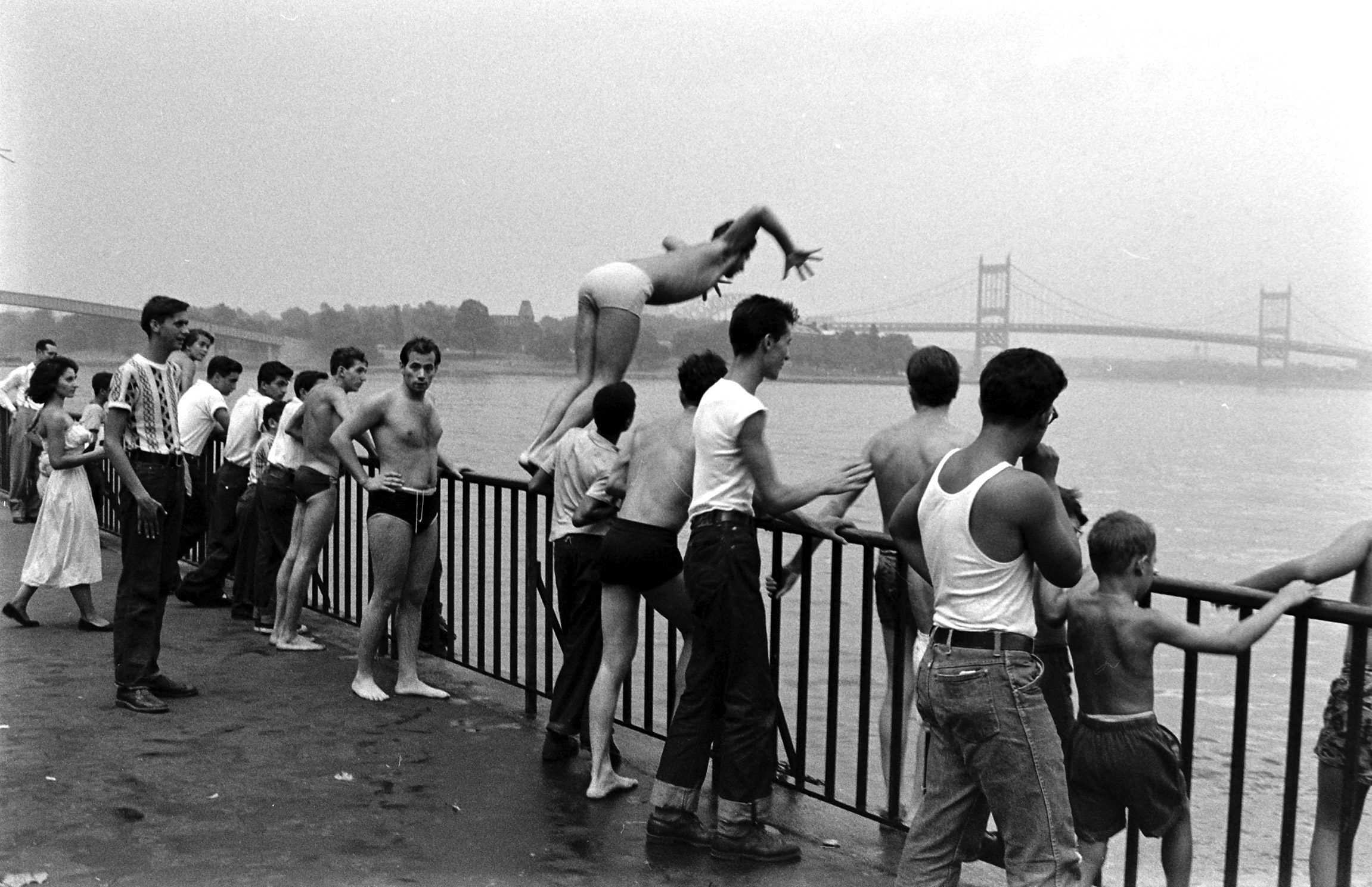 People spending time outdoors during an ongoing heatwave during the summer of 1953 in New York City.