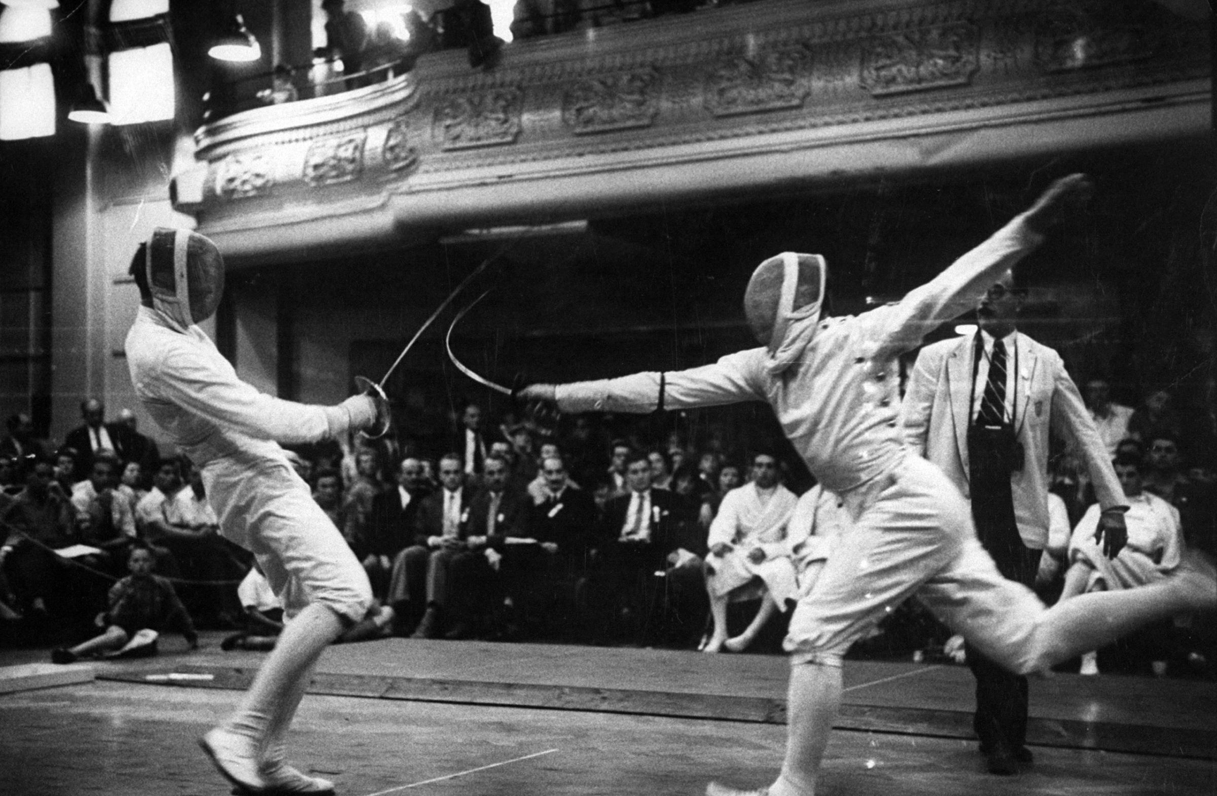 Fencers competing in the 1956 summer Olympics in Melbourne, Australia.