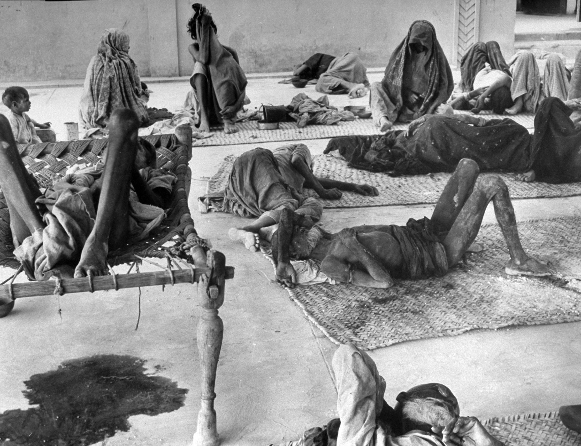 Moslem refugee cholera patients in filthy conditions at Infectious Disease Hospital upon their arrival after their long march from Delhi, India.