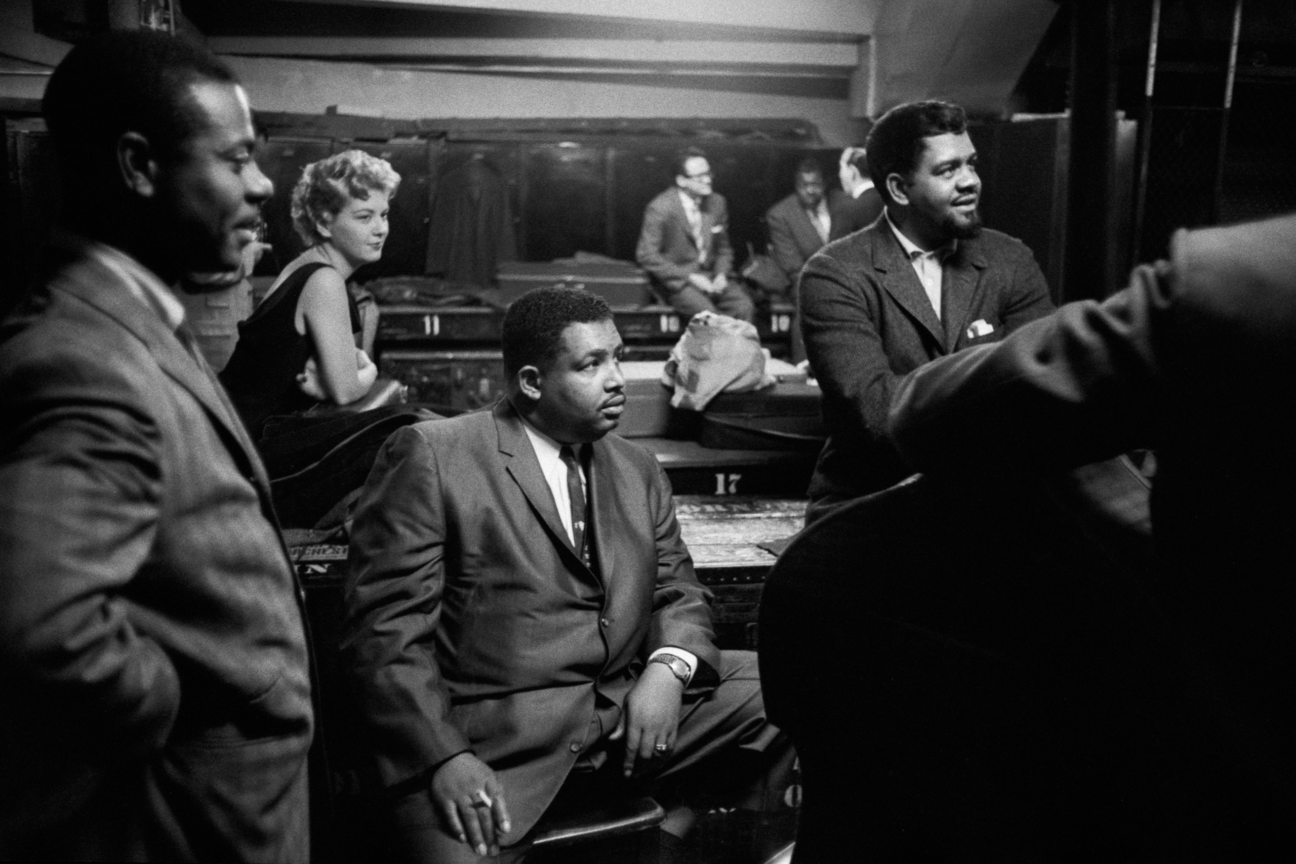 Armando Peraza, Helen Merrill,  Cannonball  Adderley, Al McKibbon, with Toots Thielmans and Oscar Peterson reflected in the mirror, backstage at Orchestra Hall, Chicago, 1957.