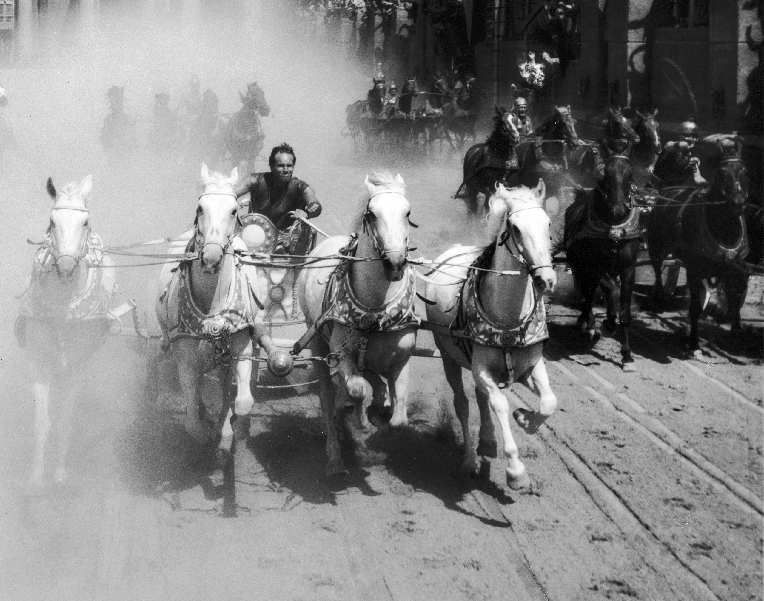 Charlton Heston competes in a chariot race in a still from the film Ben-Hur, directed by William Wyler.