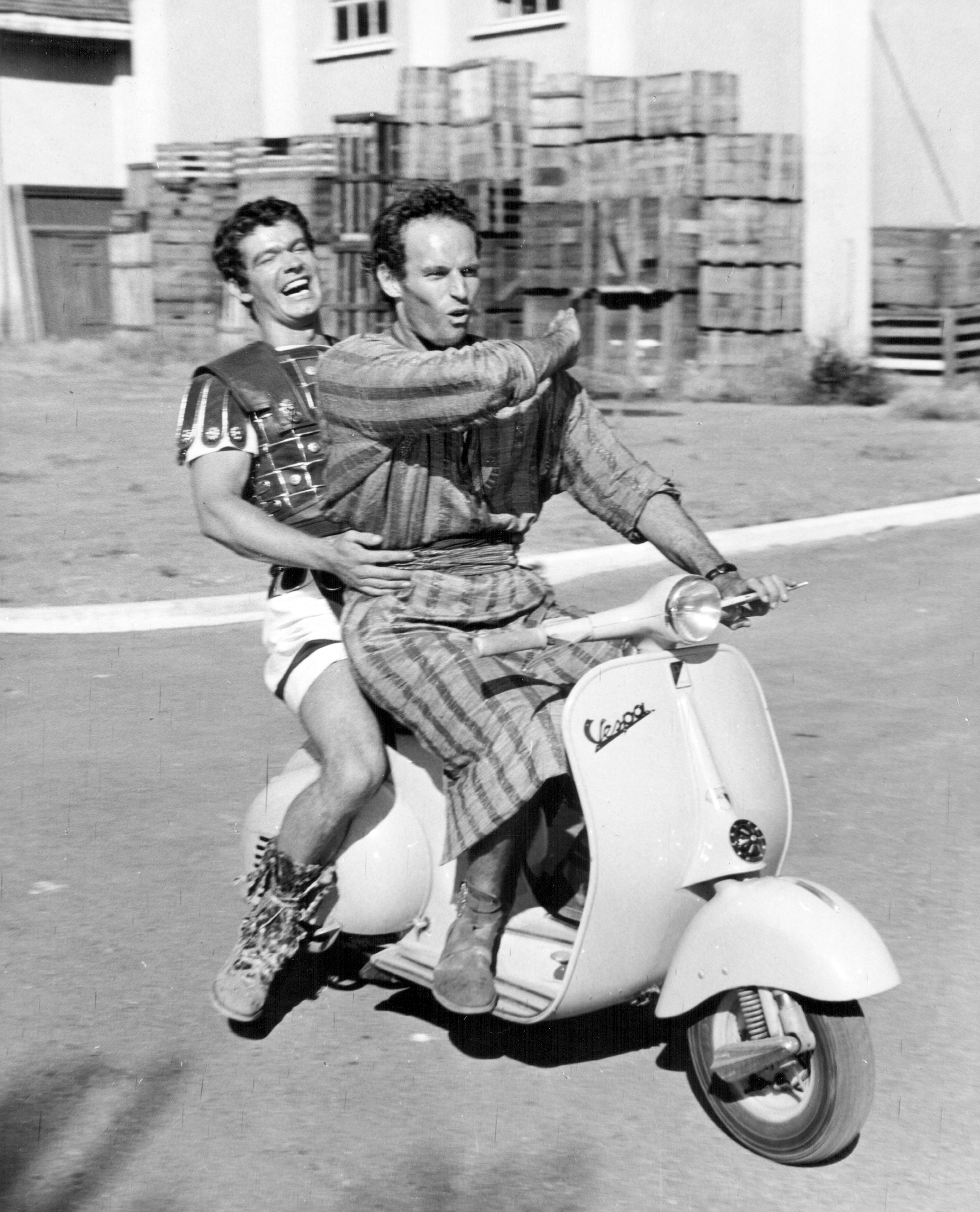 Stephen Boyd and Charlton Heston behind the scenes at Cinecitta Studios in Rome, as they appear in the movie Ben-Hur, 1959.