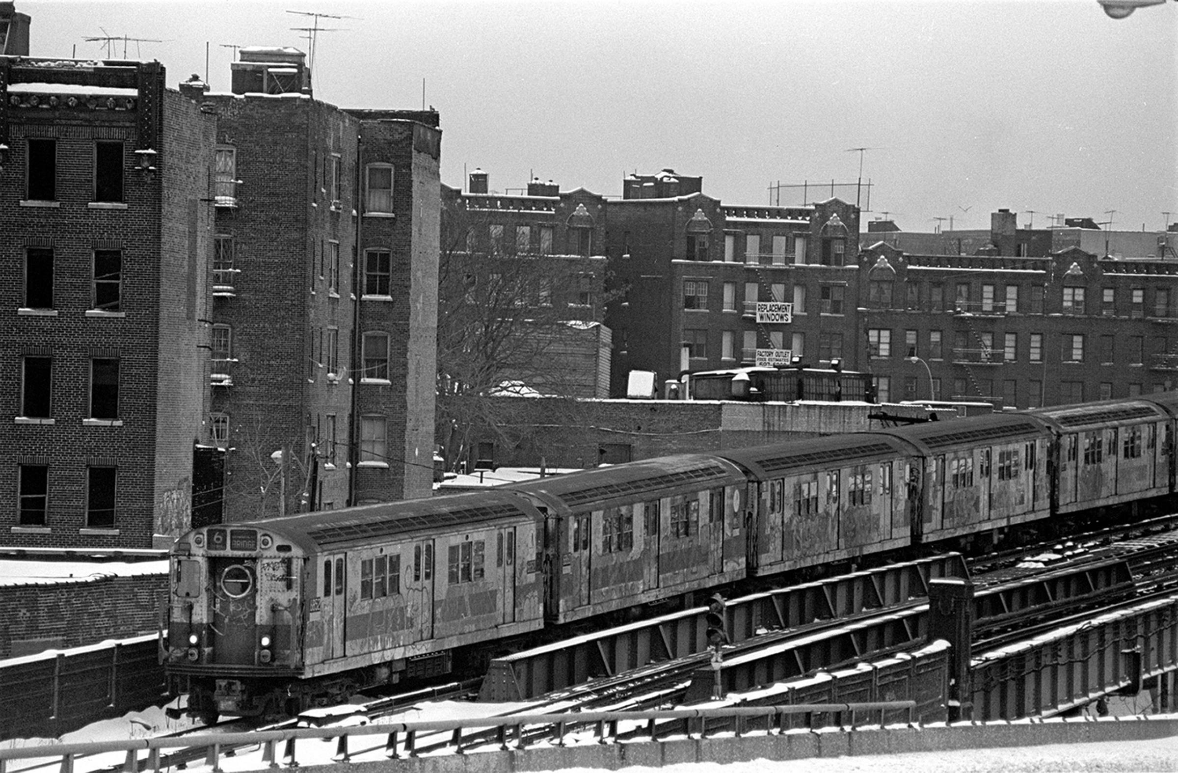 View of the number 6 local subway train as it passes through the South Bronx neighborhood, New York, New York, 1975.