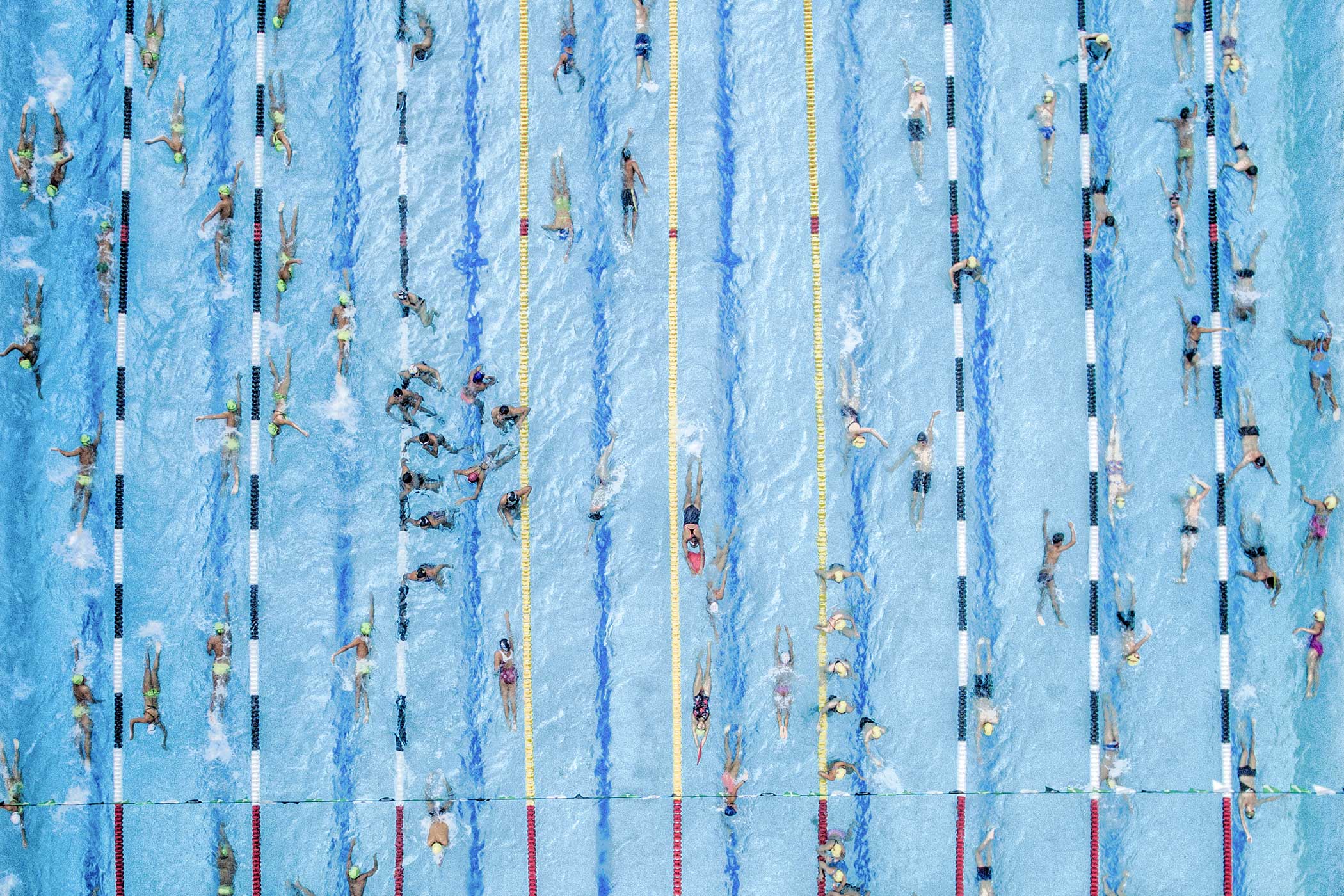 2nd Place—Sports  I work as a photojournalist in the local newspaper, La Opinión, and I was assigned the task
                              of taking a picture of the swimming competitions , which were held in the city , but instead
                              of taking the same photo as always, it occurred to me to fly my drone to try to achieve
                              something different, the result, an overhead photo of athletes warming up to begin the
                              competitions.