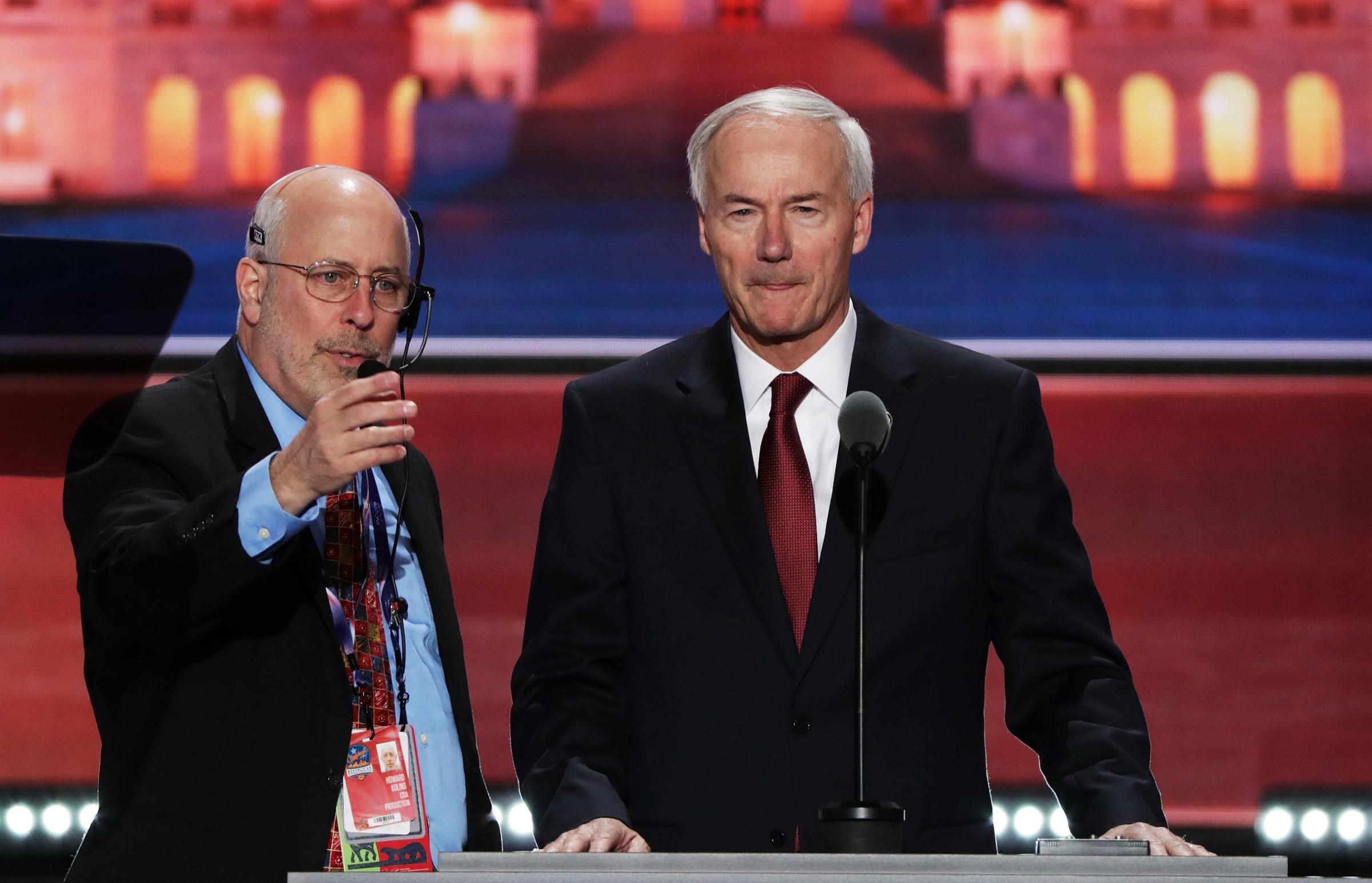 Arkansas Governor Asa Hutchinson stands on stage prior to the start of the second day of the Republican National Convention on July 19, 2016 at the Quicken Loans Arena in Cleveland.