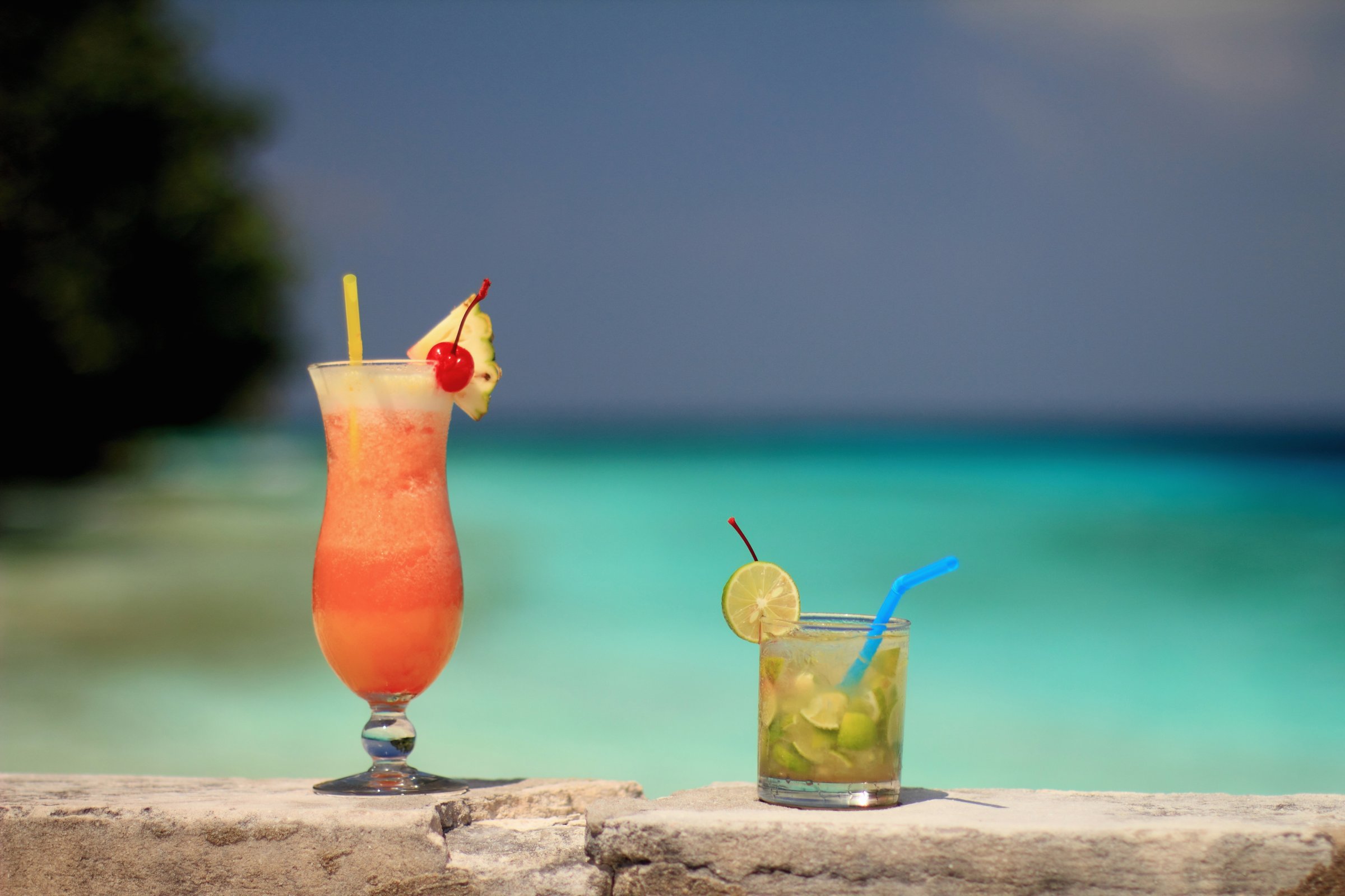 Tropical drinks on rock wall