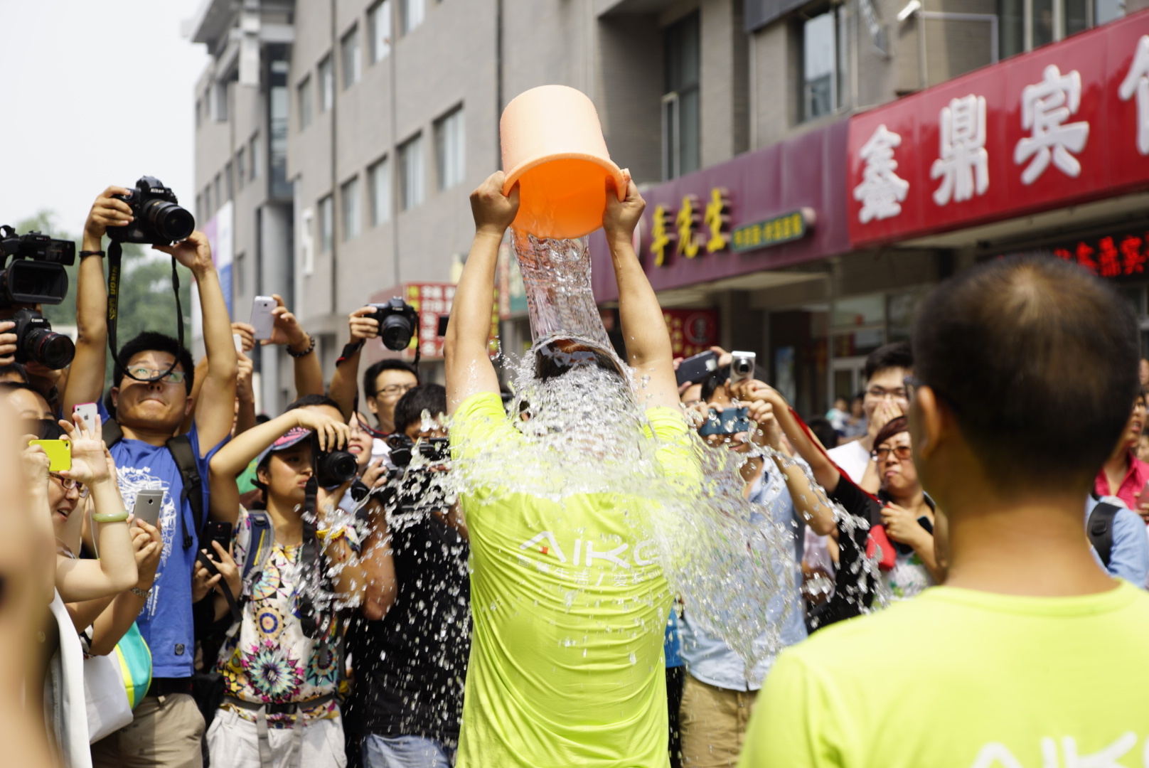 A group of people participate in the ALS Ice Bucket Challenge at  on August 21, 2014 in Beijing, China. (VCG&mdash;VCG via Getty Images)
