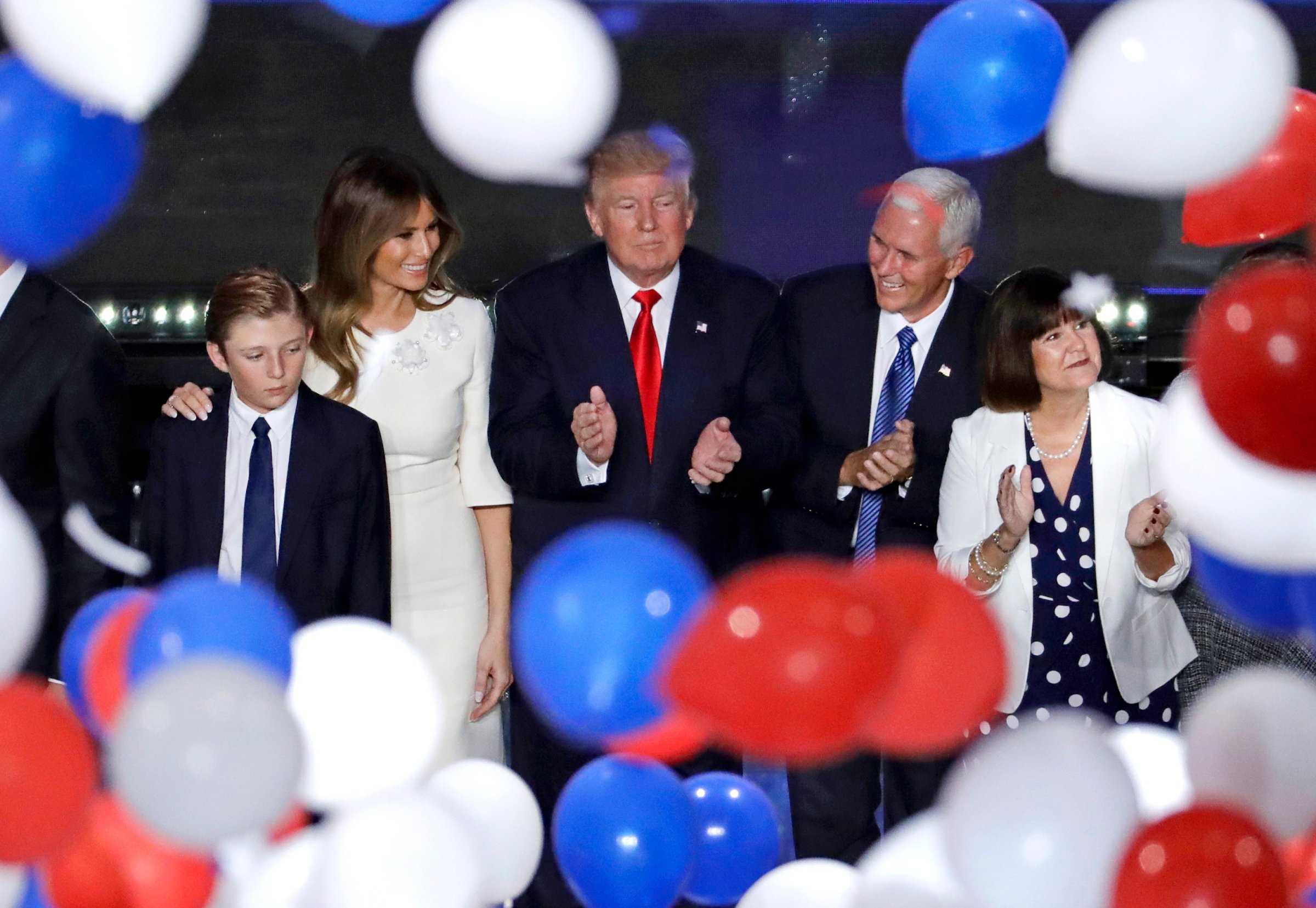 Republican presidential candidate Donald Trump, center, along with, from left, son Barron, wife Melania, Gov. Mike Pence of Indiana and Pence's wife Karen after Trump's address to delegates during the final day session of the Republican National Convention in Cleveland, July 21, 2016.