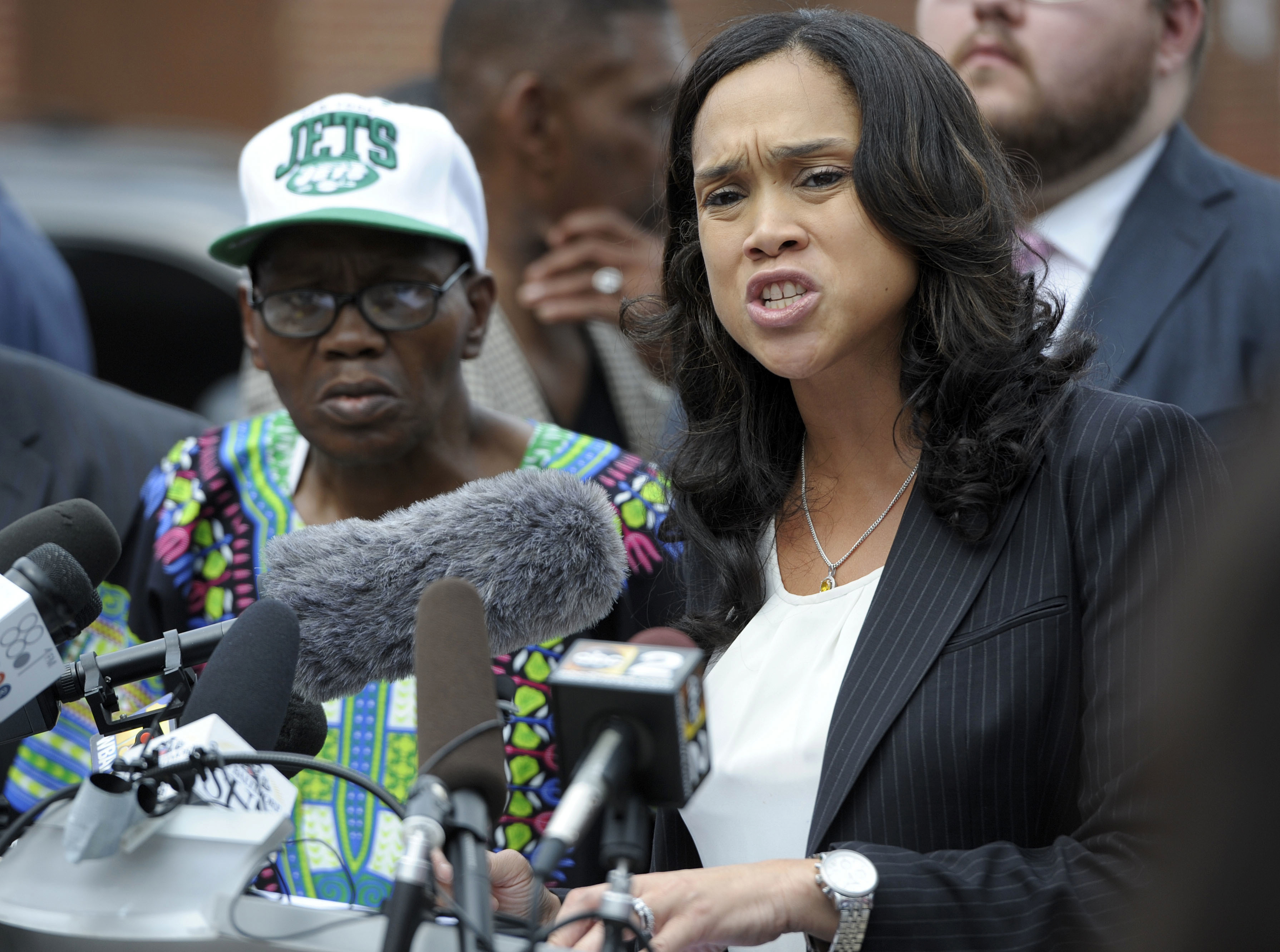 Baltimore State's Attorney Marilyn Mosby, right, holds a news conference near the site where Freddie Gray was arrested after her office dropped the remaining charges against three Baltimore police officers awaiting trial in Gray's death, in Baltimore, July 27, 2016. (Steve Ruark—AP)