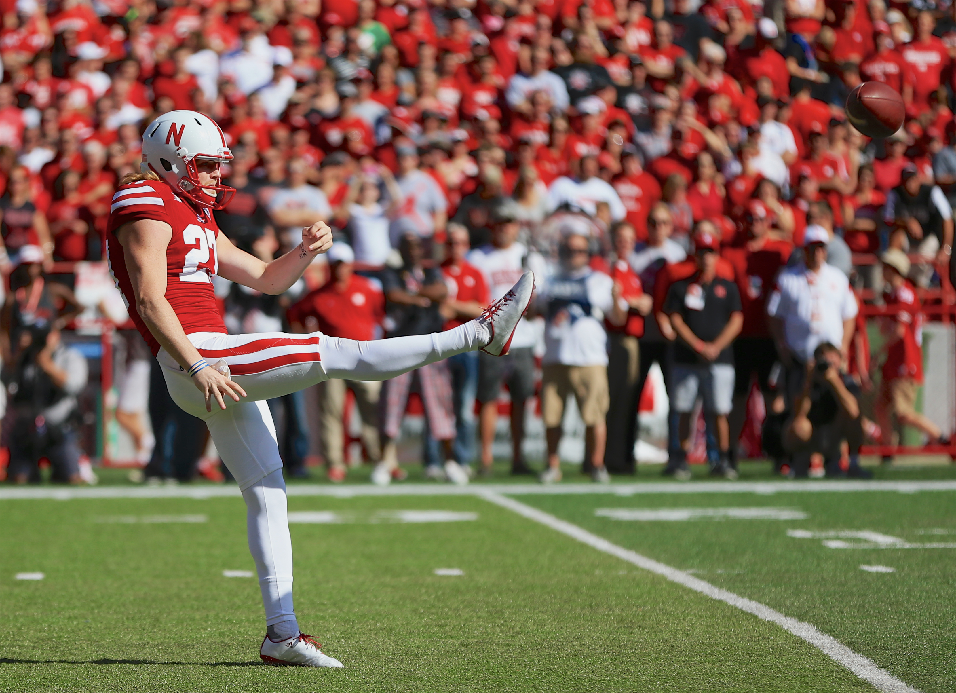 Nebraska punter Sam Foltz punts during a game against Wisconsin in Lincoln, Neb., Oct. 10, 2015. Foltz was killed in a car wreck in Wisconsin on Saturday (Nati Harnik—AP)
