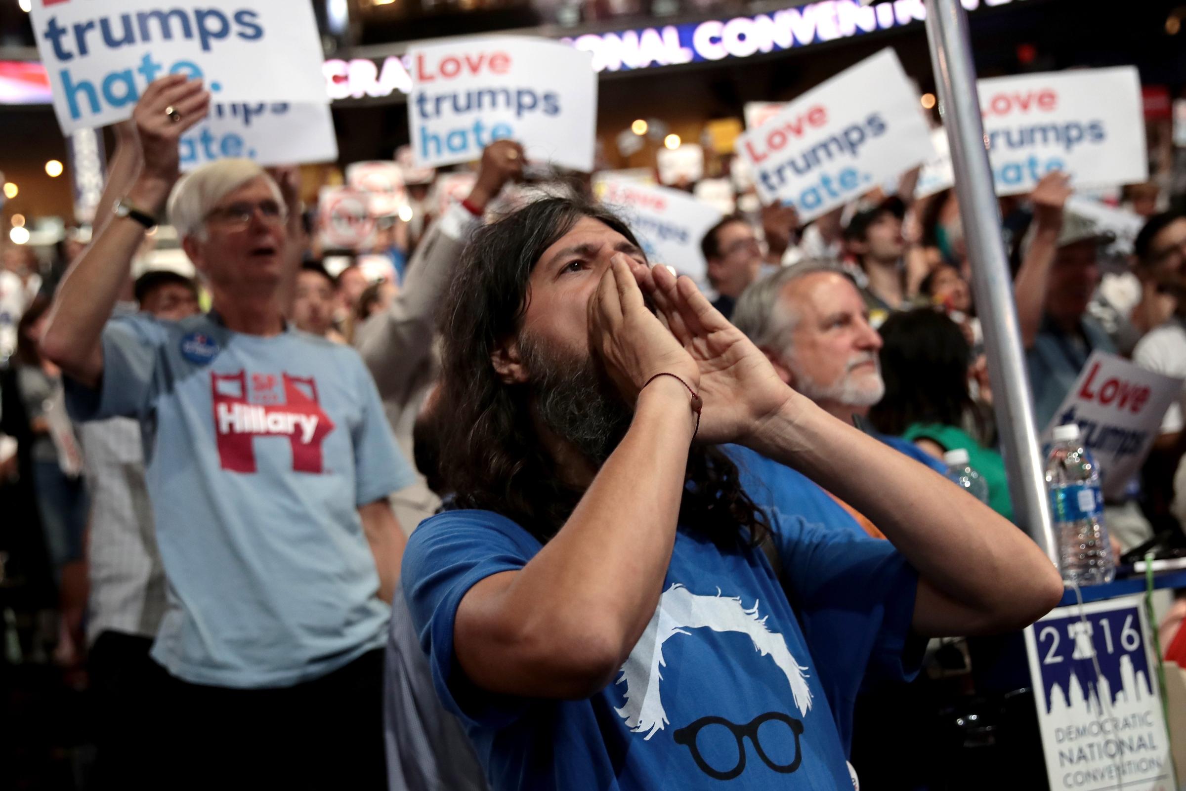 A supporter of Sen. Bernie Sanders (I-VT) chants on the first day of the Democratic National Convention at the Wells Fargo Center.