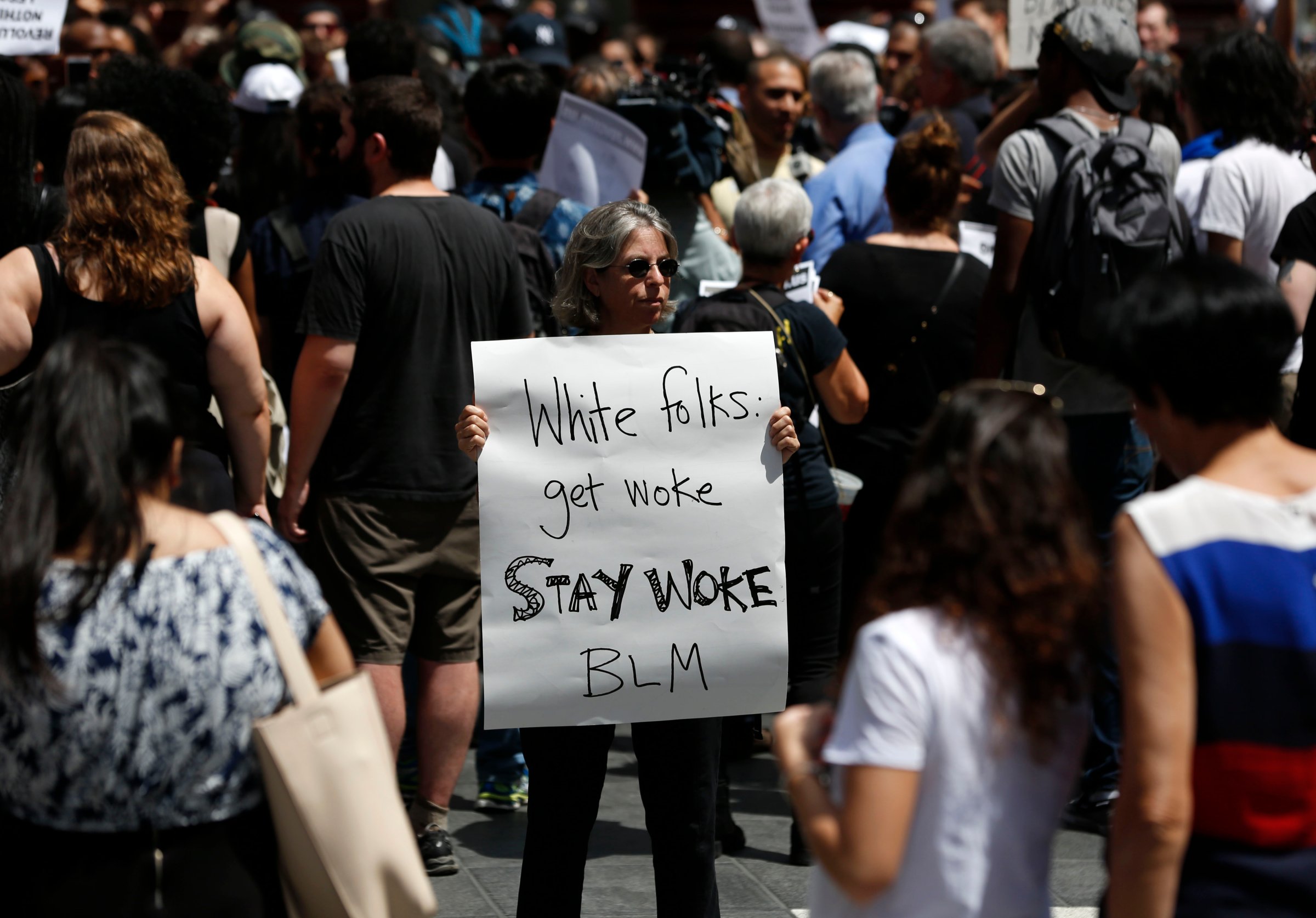 Protesters hold signs during a Black Lives Matter demonstration in New York, July 10, 2016.