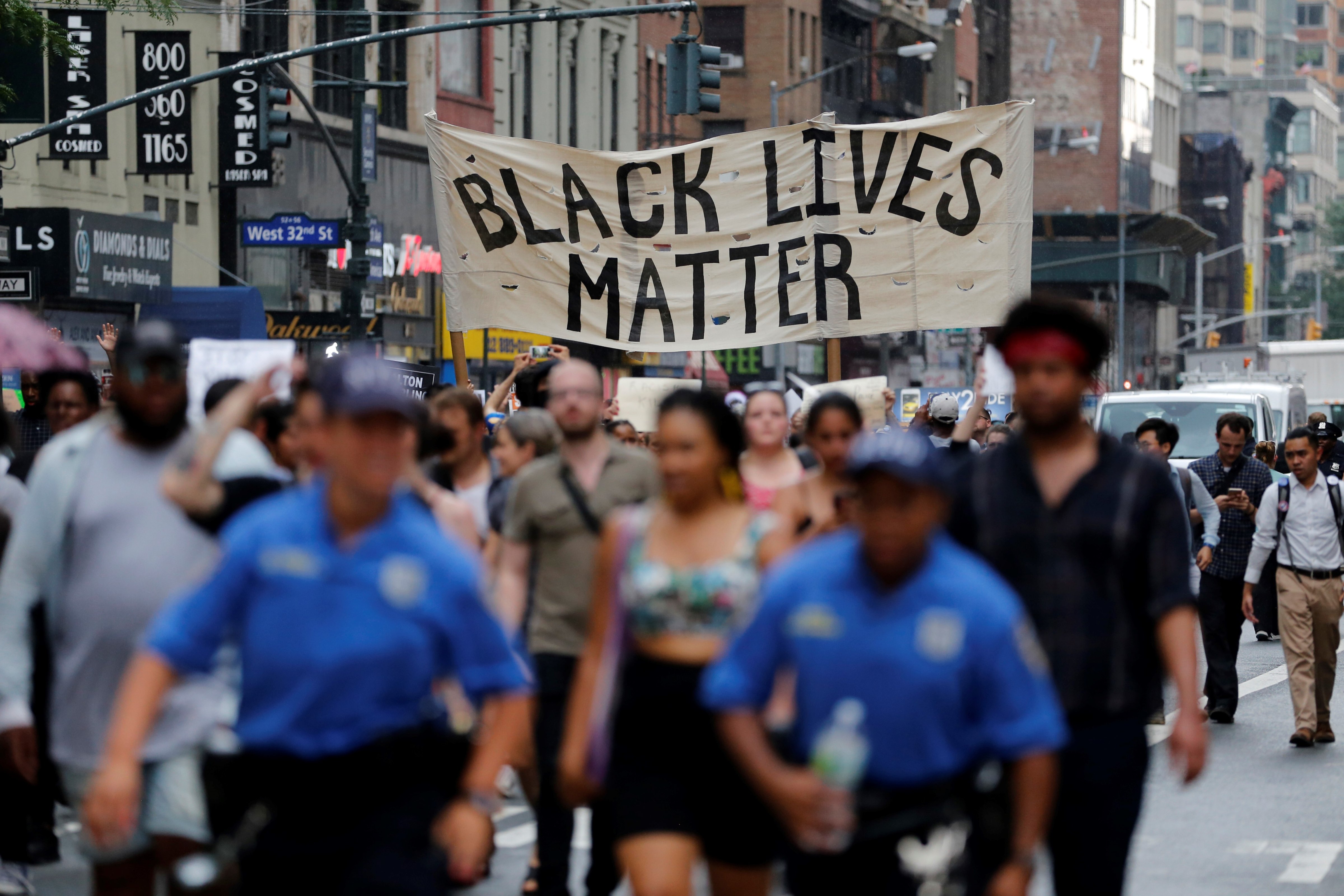 Hundreds gather in Manhattan on July 7 to protest recent police-related shootings