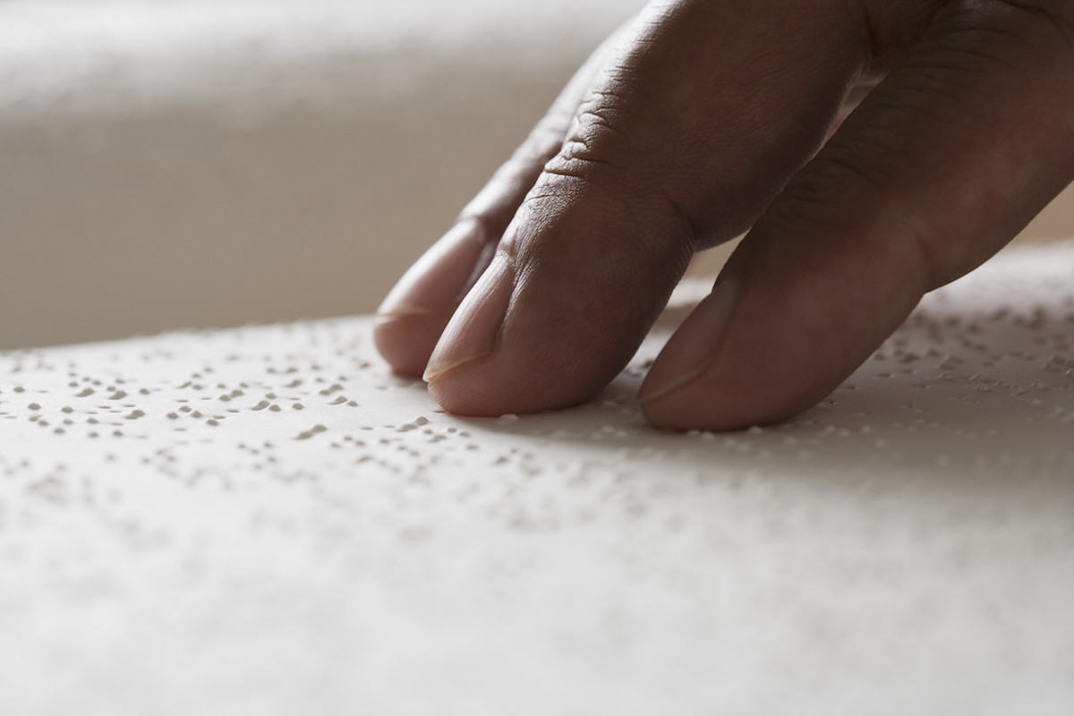 Close up of hand reading Braille (Blend Images / JGI / Getty Images)