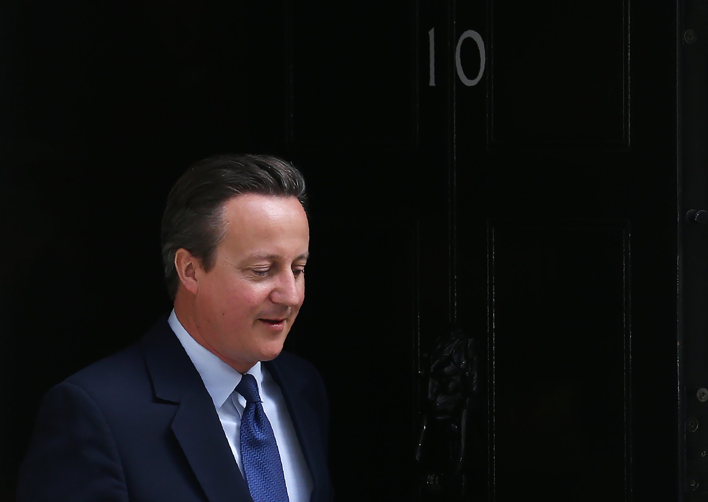 Britain's ougoing Prime Minister David Cameron leaves 10 Downing Street as he prepares to address his final Prime Minister's Question Time in the House of Commons in London on July 13, 2016.