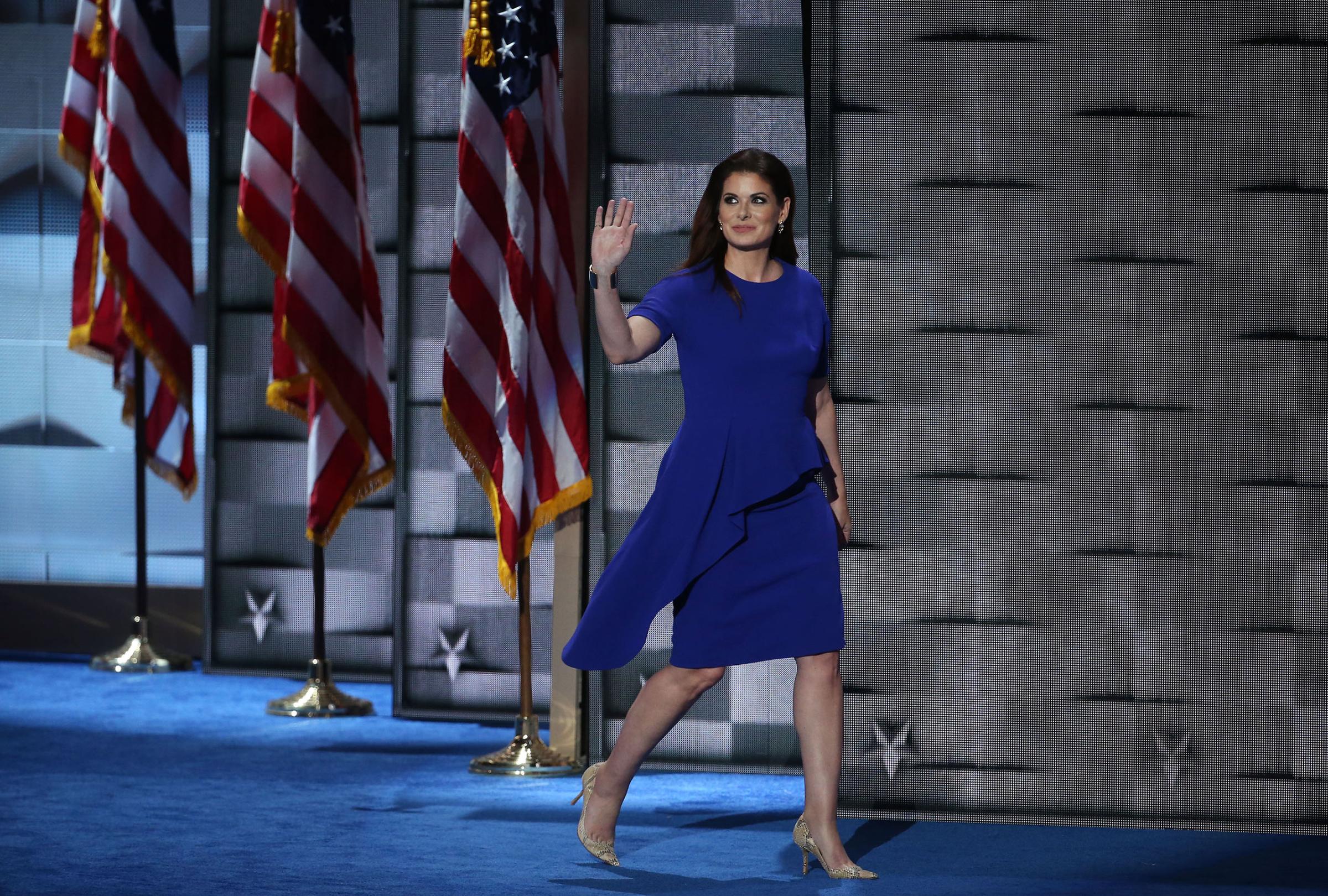 Actress Debra Messing waves while arriving on stage during the Democratic National Convention (DNC) in Philadelphia, Pennsylvania, July 26, 2016.