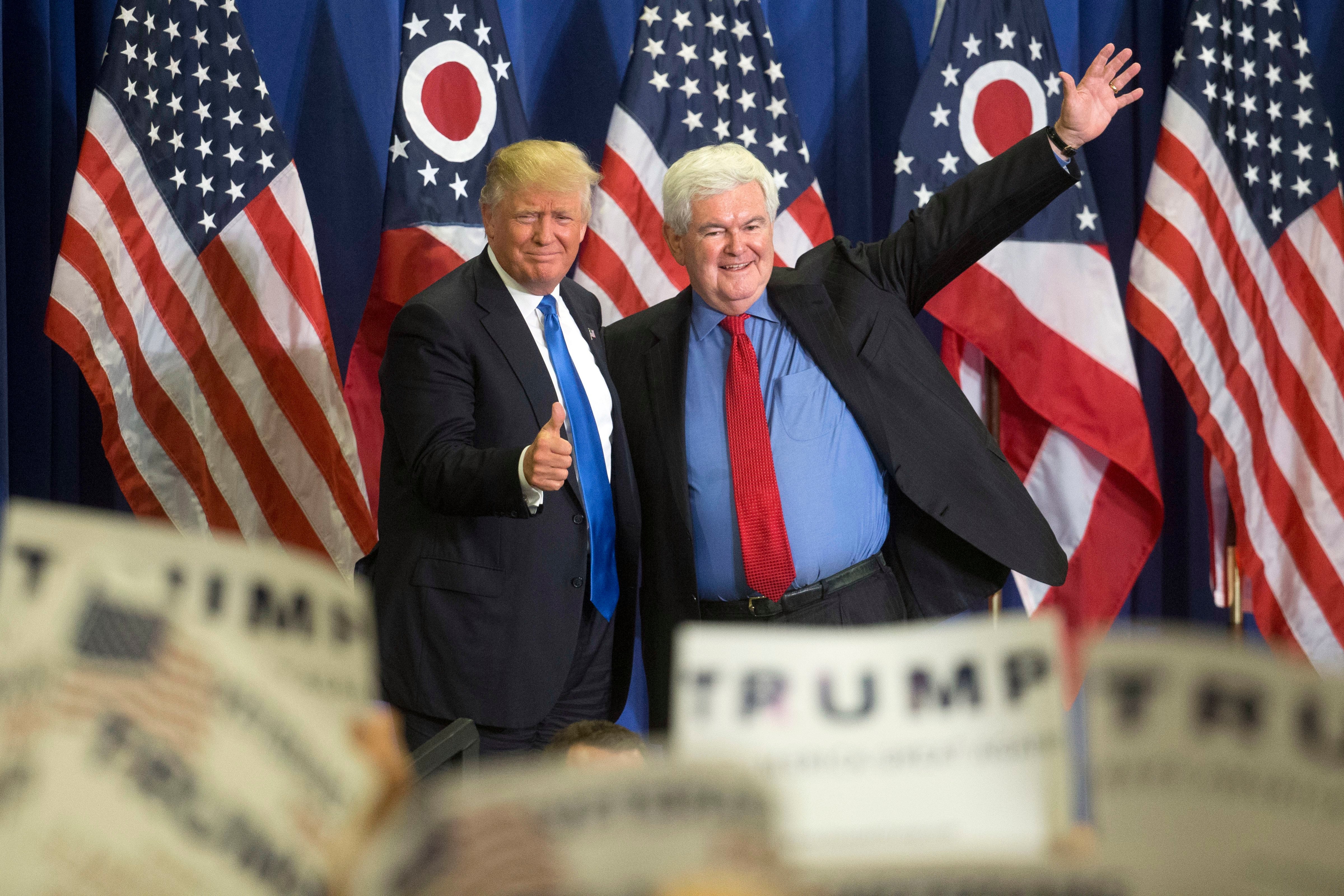 Republican presidential candidate Donald Trump, left, and former House Speaker Newt Gingrich, right, acknowledge the crowd during a campaign rally at the Sharonville Convention Center on July 6, 2016, in Cincinnati. (John Minchillo—AP)