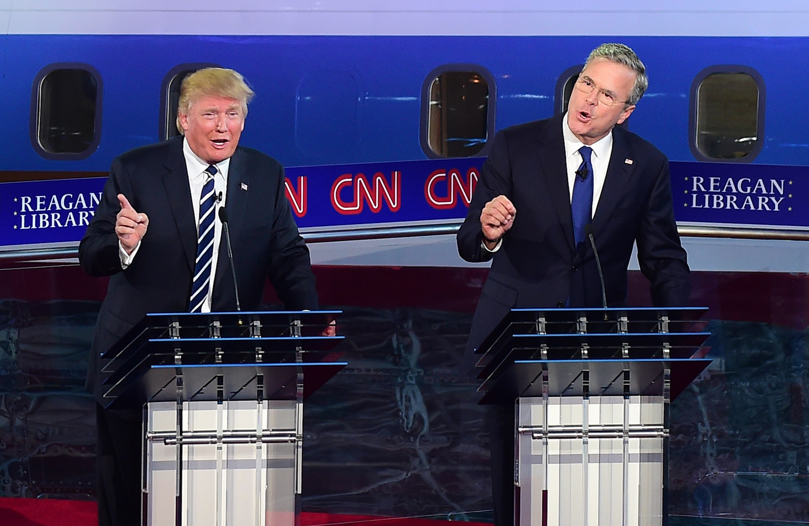 Republican presidential hopeful real estate magnate Donald Trump and former Florida Gov. Jeb Bush speak during the Republican presidential debate at the Ronald Reagan Presidential Library in Simi Valley, California on September 16, 2015. (FREDERIC J BROWN—AFP/Getty Images)