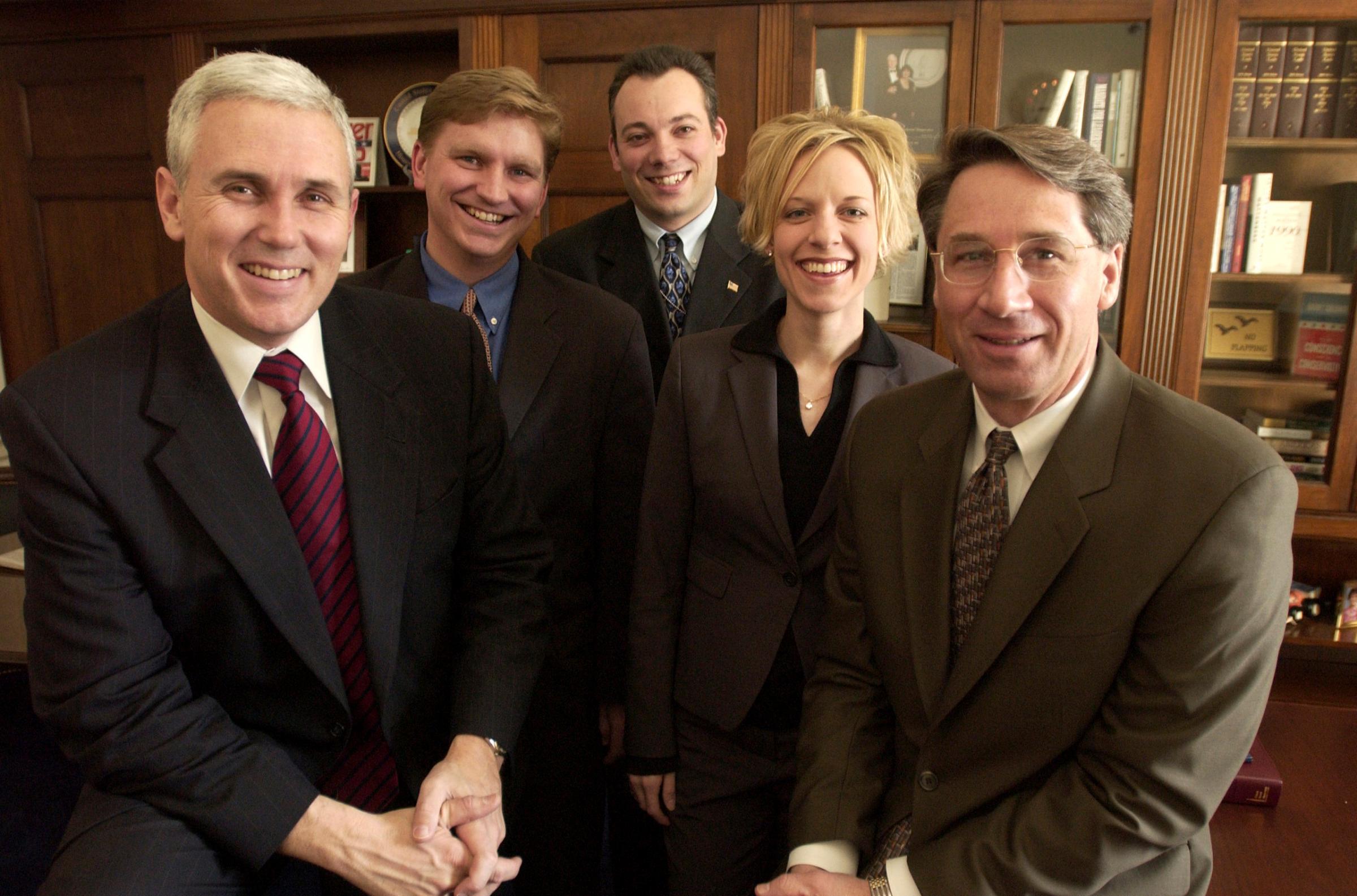 Rep. Mike Pence, R-Ind. (left), Derek Karachner, Ian Slatter, Molly Jurmu, and Mark Ahearn pose for a group portrait on Dec. 12, 2001.