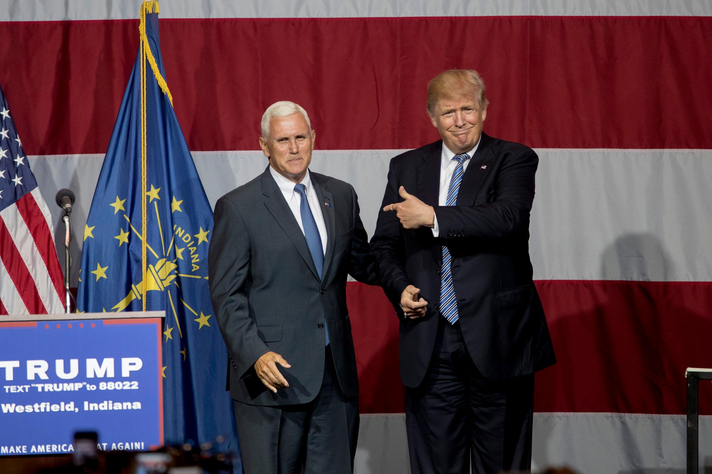 Republican presidential candidate Donald Trump greets Indiana Gov. Mike Pence at the Grand Park Events Center in Westfield, Ind. on July 12, 2016.