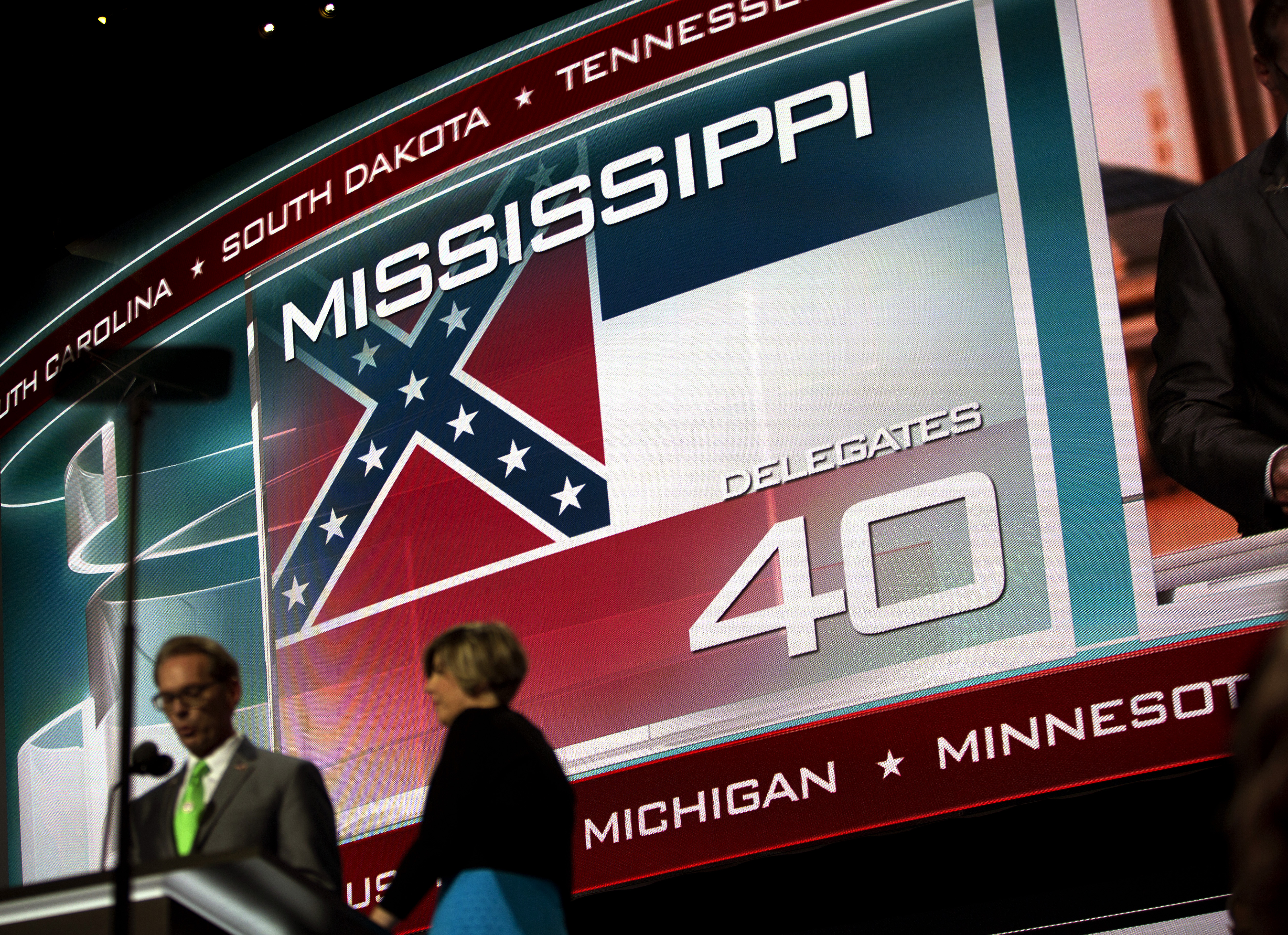 A screen displays the state flag of Mississippi, the only state that includes the Confederate battle emblem in its official state flag, at the Republican National Convention in Cleveland on Tuesday, July 19, 2016.