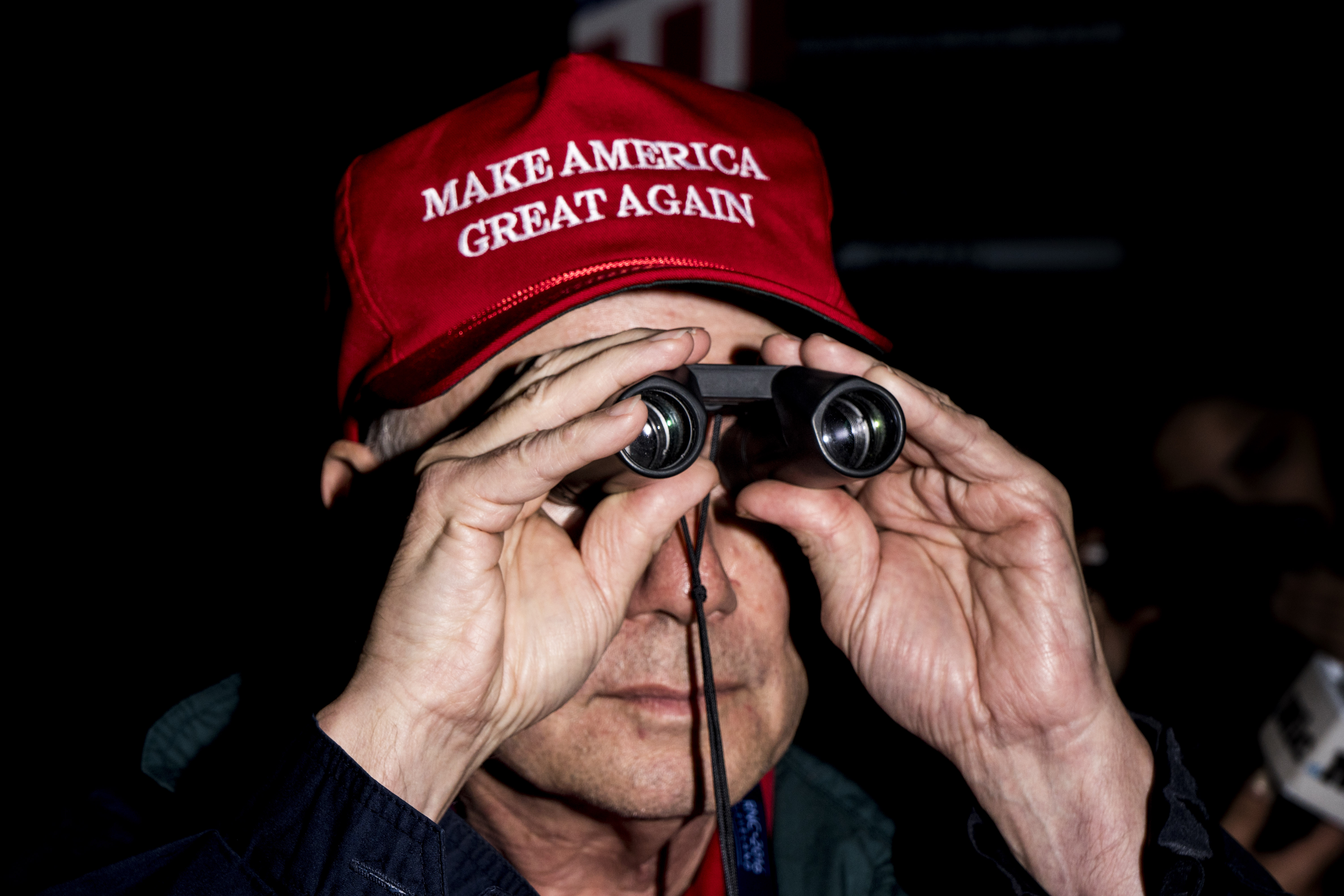 A man dons a  Make America Great Again  hat at the Republican National Convention in Cleveland.
