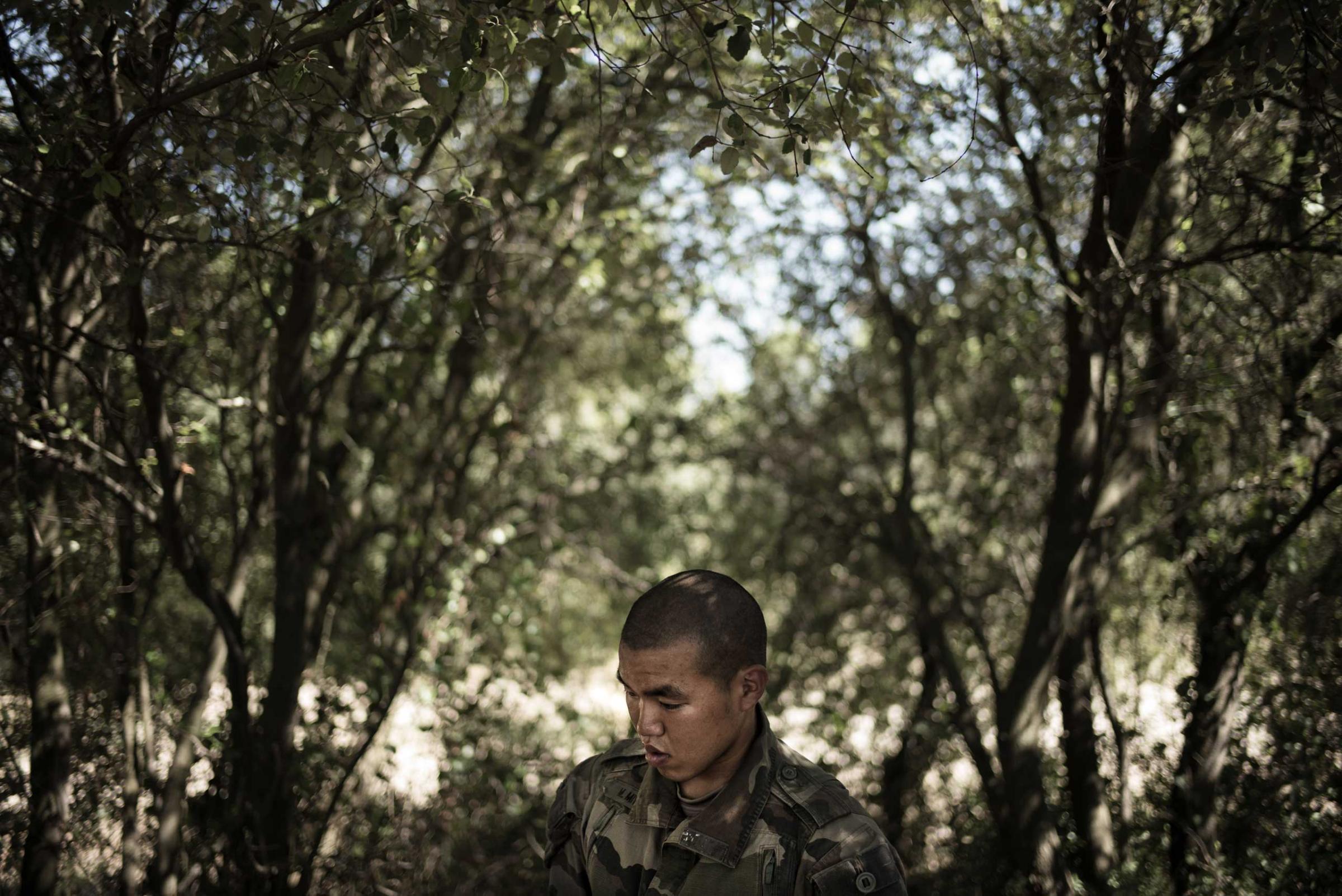 A Japanese Legionnaire is waiting for instructions during his training. Nimes, France. Aug. 11, 2015.