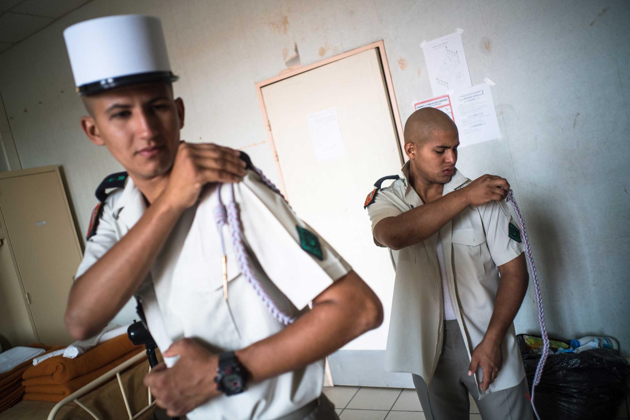 Two members of the French Foreign Legion get ready for the weekend. Nimes, France. Aug. 12, 2015.