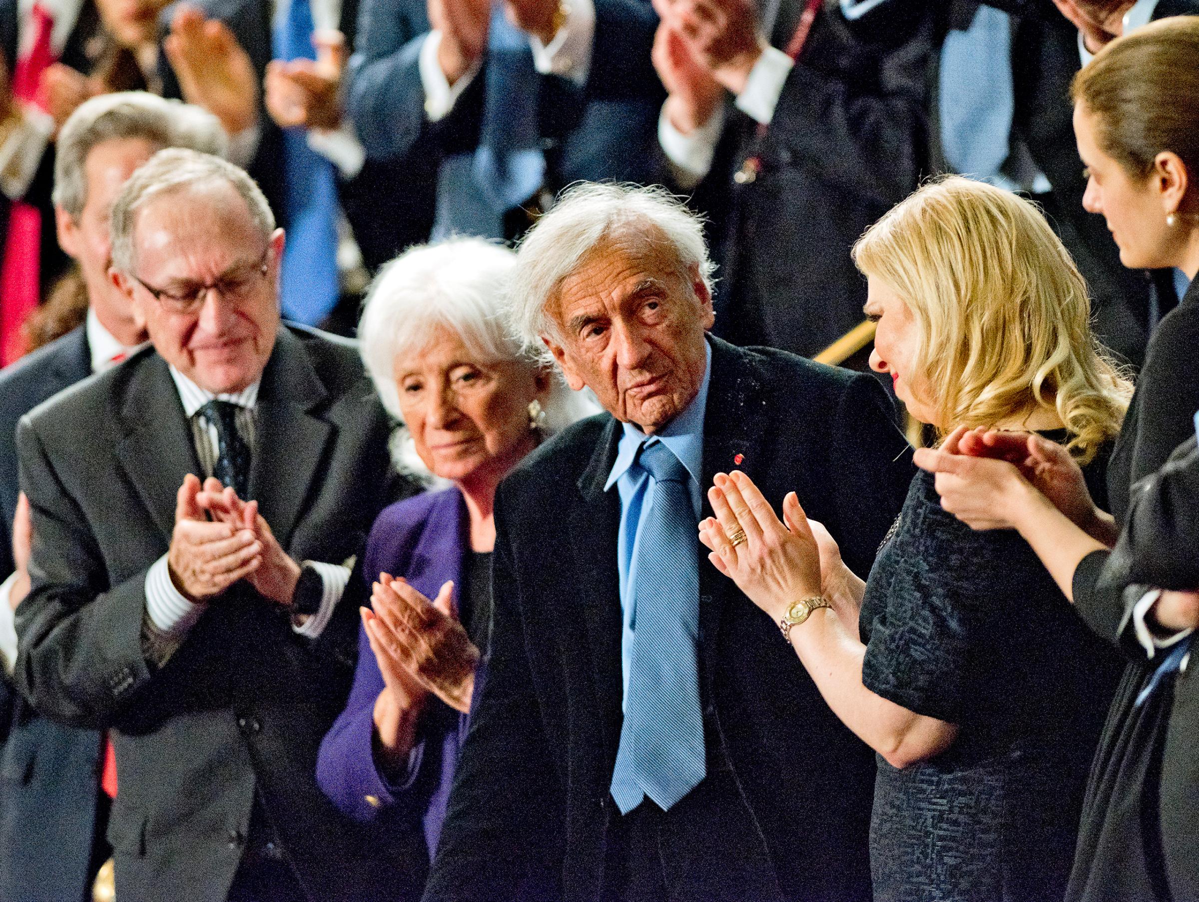 Elie Wiesel stands after he was recognized during the address of Prime Minister Benjamin Netanyahu of Israel to a joint session of the United States Congress in the U.S. Capitol in Washington, D.C. on March 3, 2015.