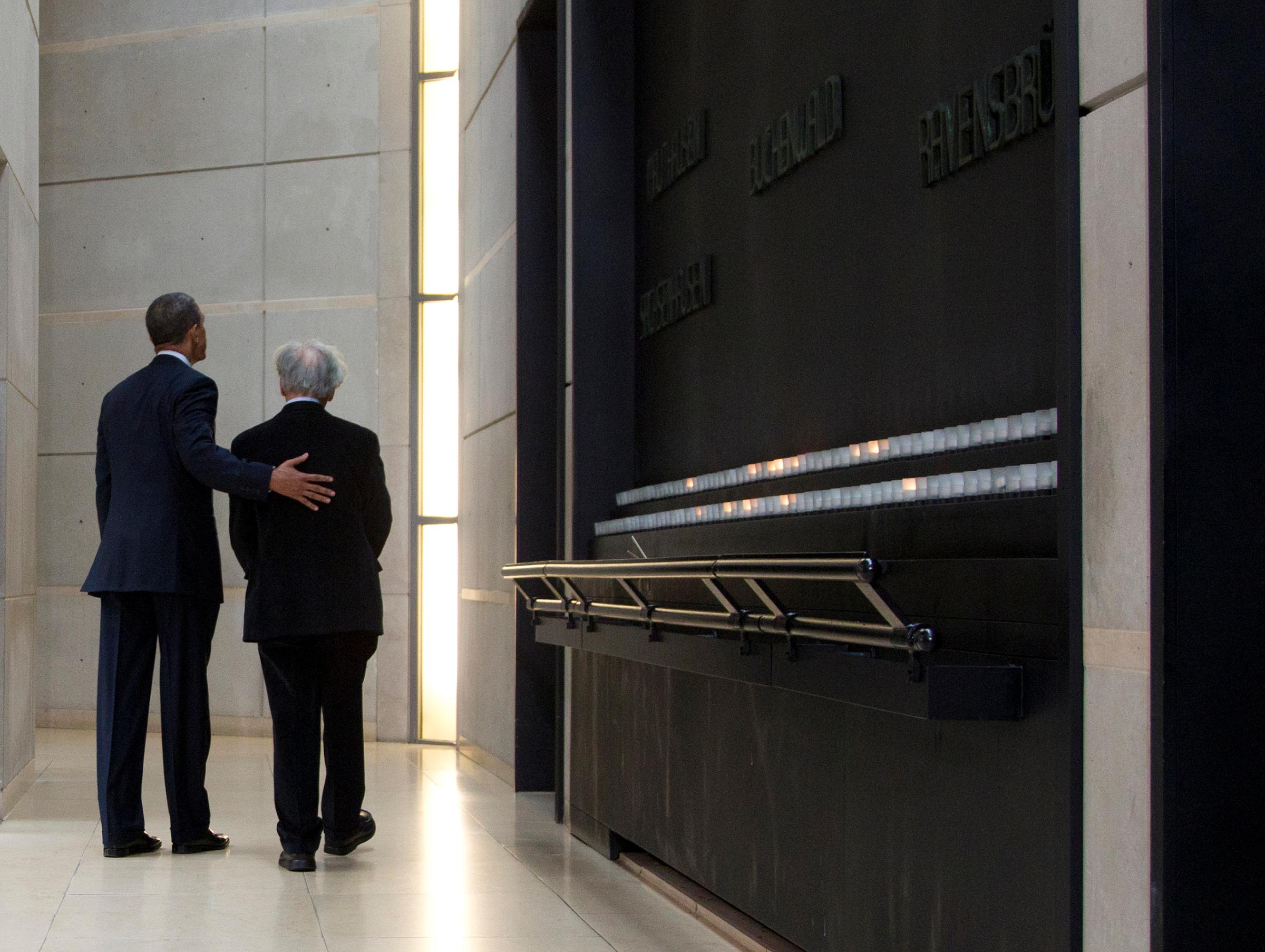 President Barack Obama and Nobel Peace Prize laureate and Holocaust survivor Elie Wiesel turn to leave after lighting candles in the Hall of Remembrance as they tour the Holocaust Memorial Museum in Washington on April 23, 2012.