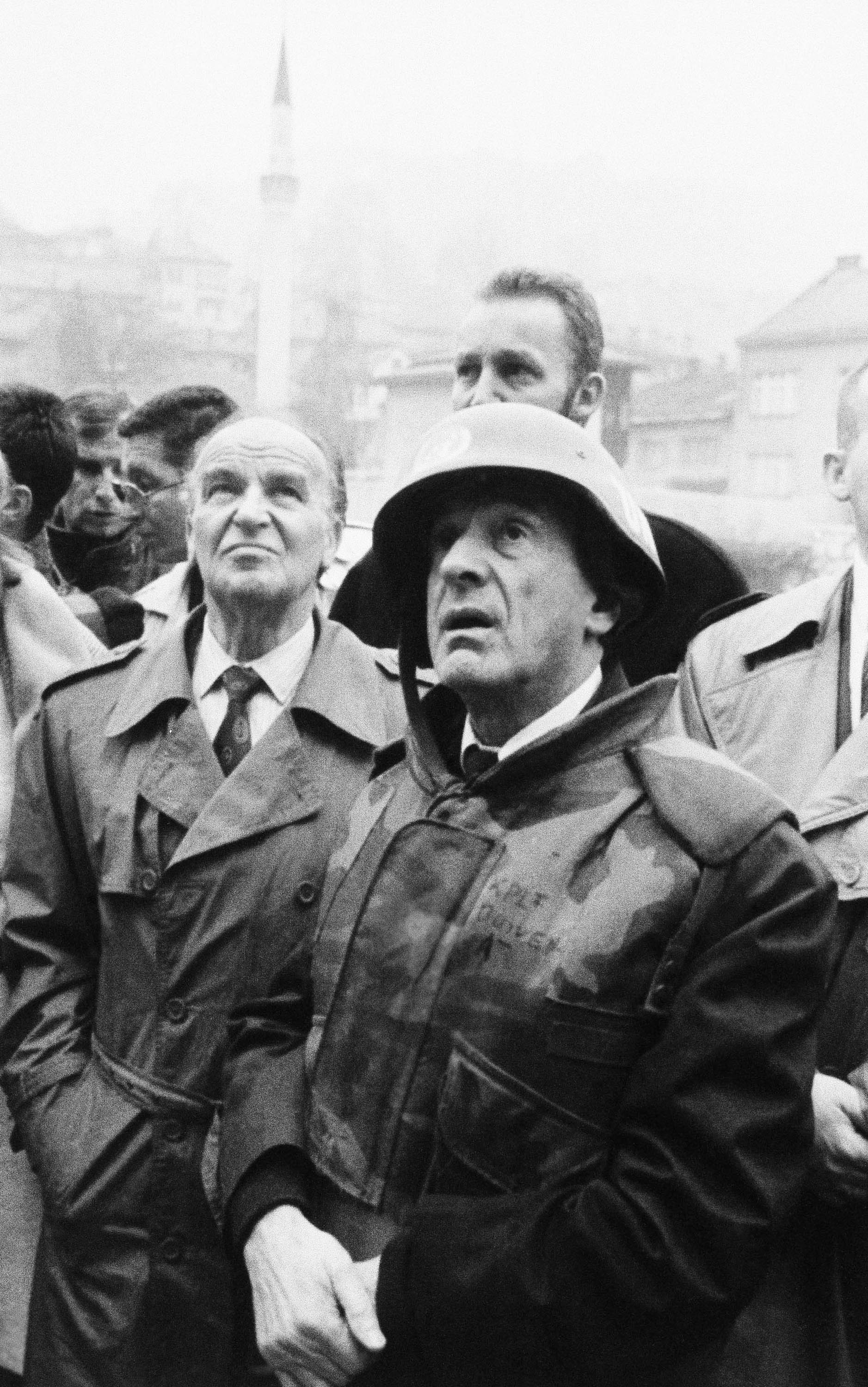 Nobel Peace Prize winner Elie Wiesel, right, and Bosnian President Ali Ja Izetbegovic, left, look at war-torn ruins in the old part of Sarajevo, Bosnia and Herzegovina on Nov. 29, 1992. Wiesel, seen here wearing a U.N. peacekeeping force helmet and flak jacket, was making a four-day tour of the war zone.